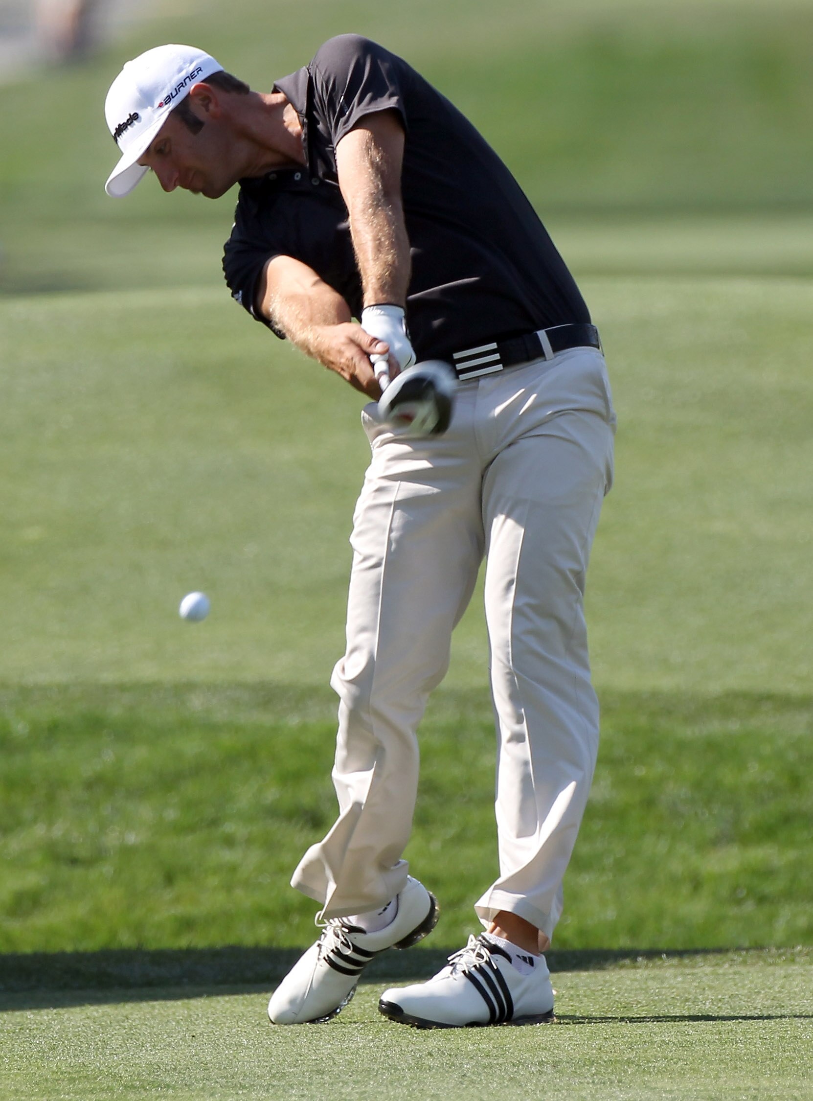 ORLANDO, FL - MARCH 25:  Dustin Johnson plays a shot on the 18th hole during the second round of the Bay Hill Invitational presented by MasterCard at the Bay Hill Club and Lodge on March 25, 2011 in Orlando, Florida.  (Photo by Sam Greenwood/Getty Images)