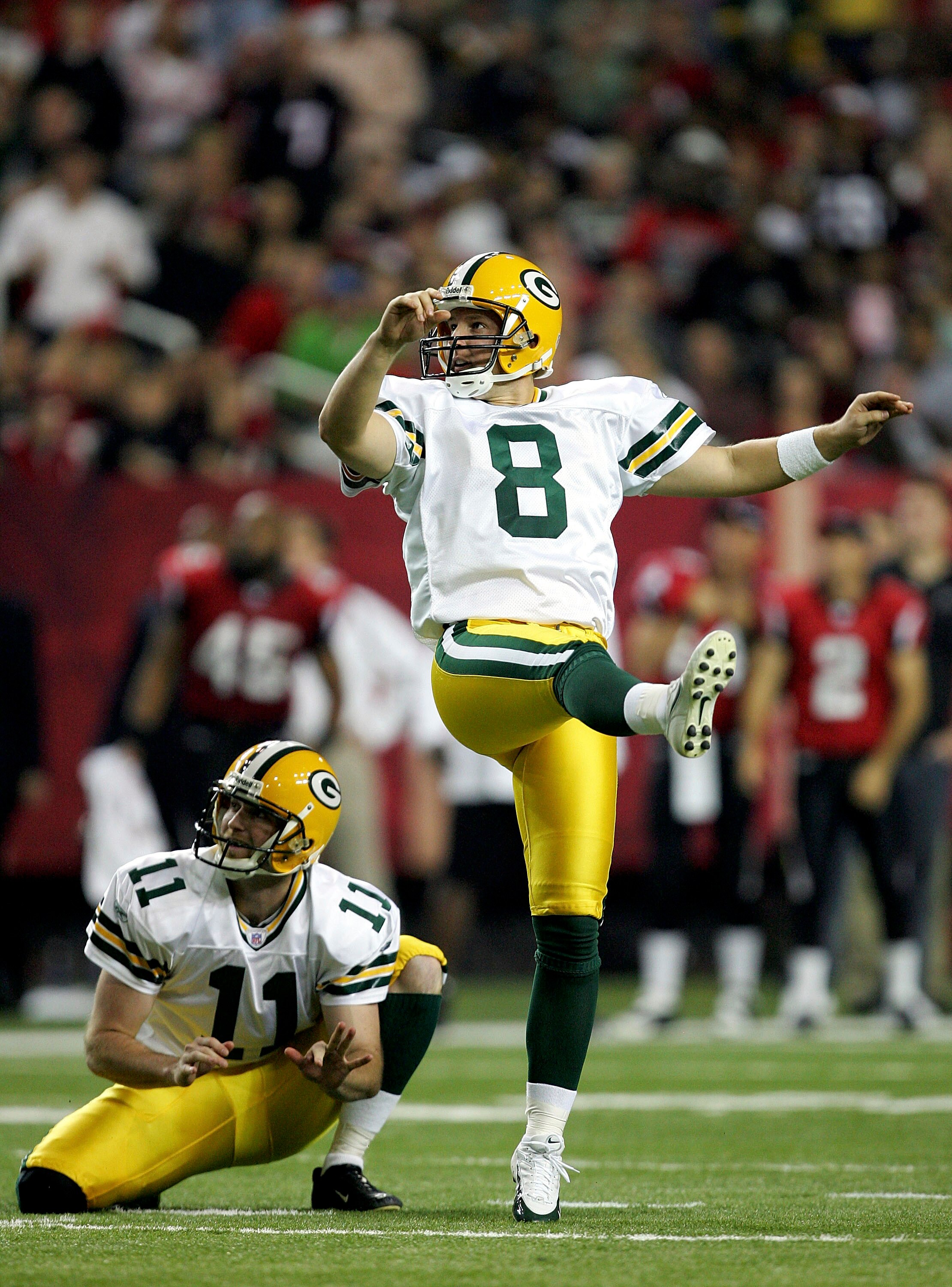 ATLANTA - NOVEMBER 13:  Ryan Longwell #8 of the Green Bay Packers watches a kick with teammate B.J. Sander #11 during their game against the Atlanta Falcons on November 13, 2005 at the Georgia Dome in Atlanta, Georgia.  (Photo by Streeter Lecka/Getty Imag