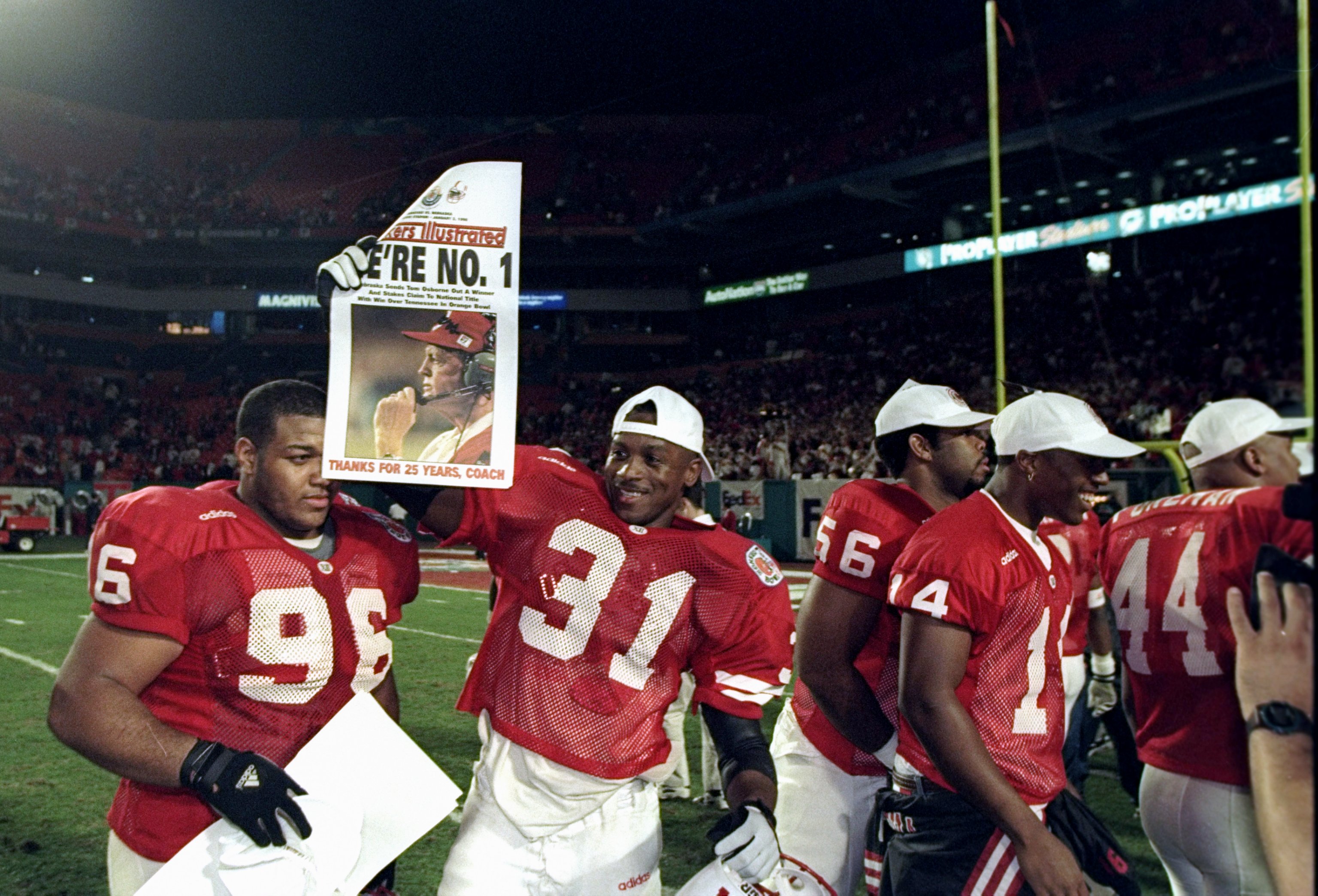 2 Jan 1998: Several Nebraska Cornhuskers players celebrate after the Orange Bowl against the Tennessee Volunteers at Pro Player Stadium in Miami, Florida. Nebraska won the game, 42-17.