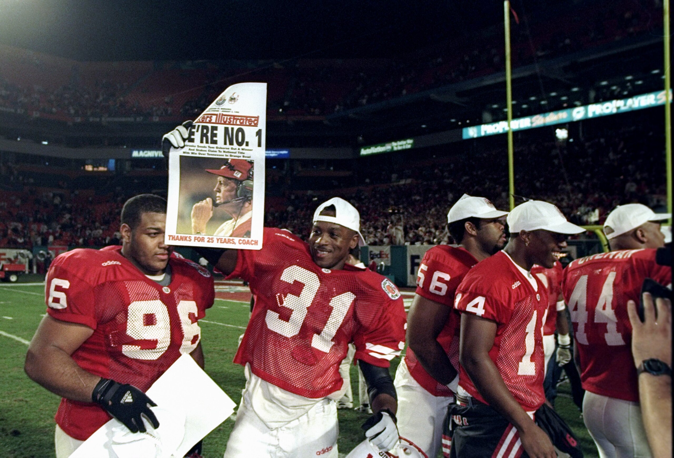 2 Jan 1998: Several Nebraska Cornhuskers players celebrate after the Orange Bowl against the Tennessee Volunteers at Pro Player Stadium in Miami, Florida. Nebraska won the game, 42-17.