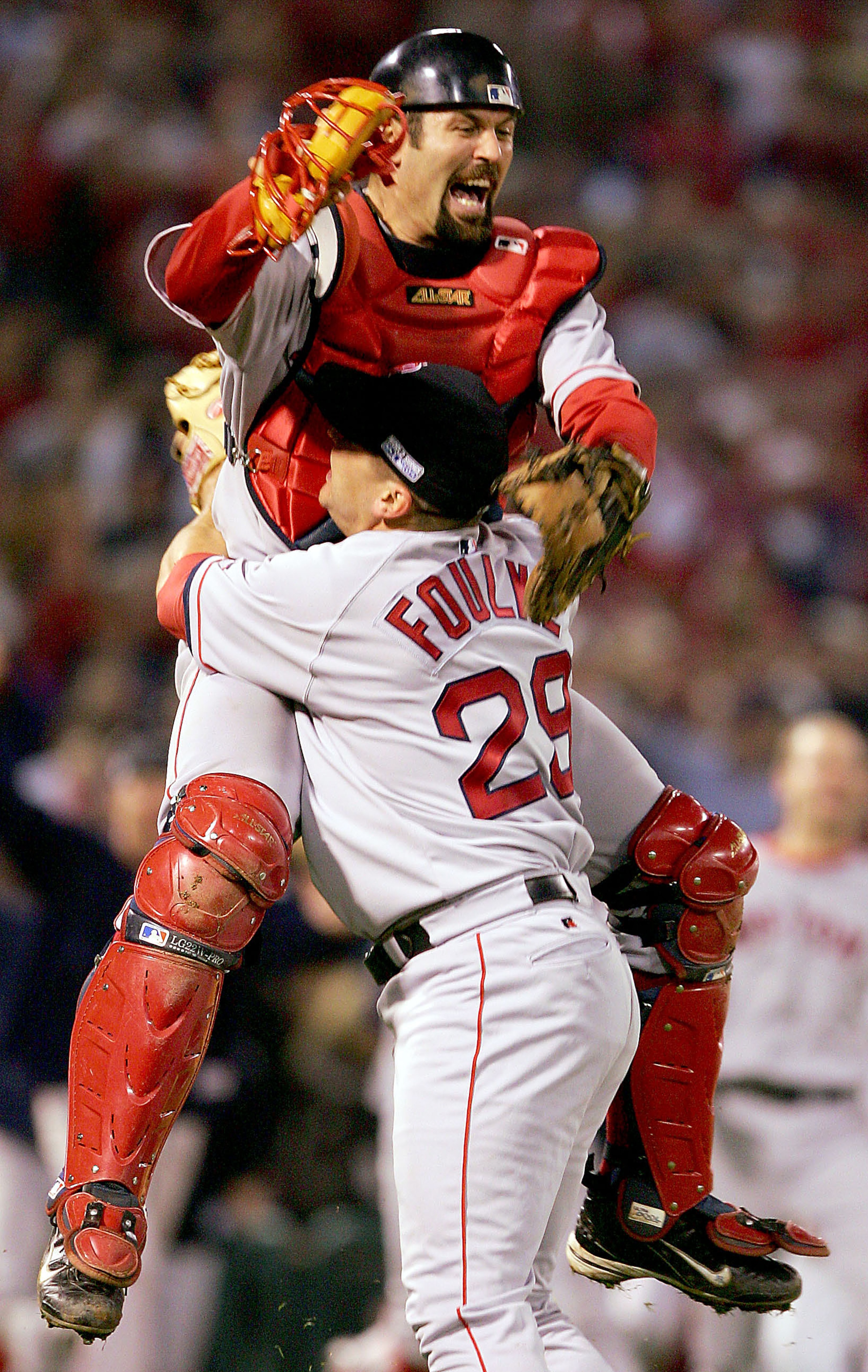 ST LOUIS - OCTOBER 27:  Jason Varitek #33 and Keith Foulke #29 of the Boston Red Sox celebrate after defeating the St. Louis Cardinals 3-0 in game four of the World Series on October 27, 2004 at Busch Stadium in St. Louis, Missouri. (Photo by Jed Jacobsoh
