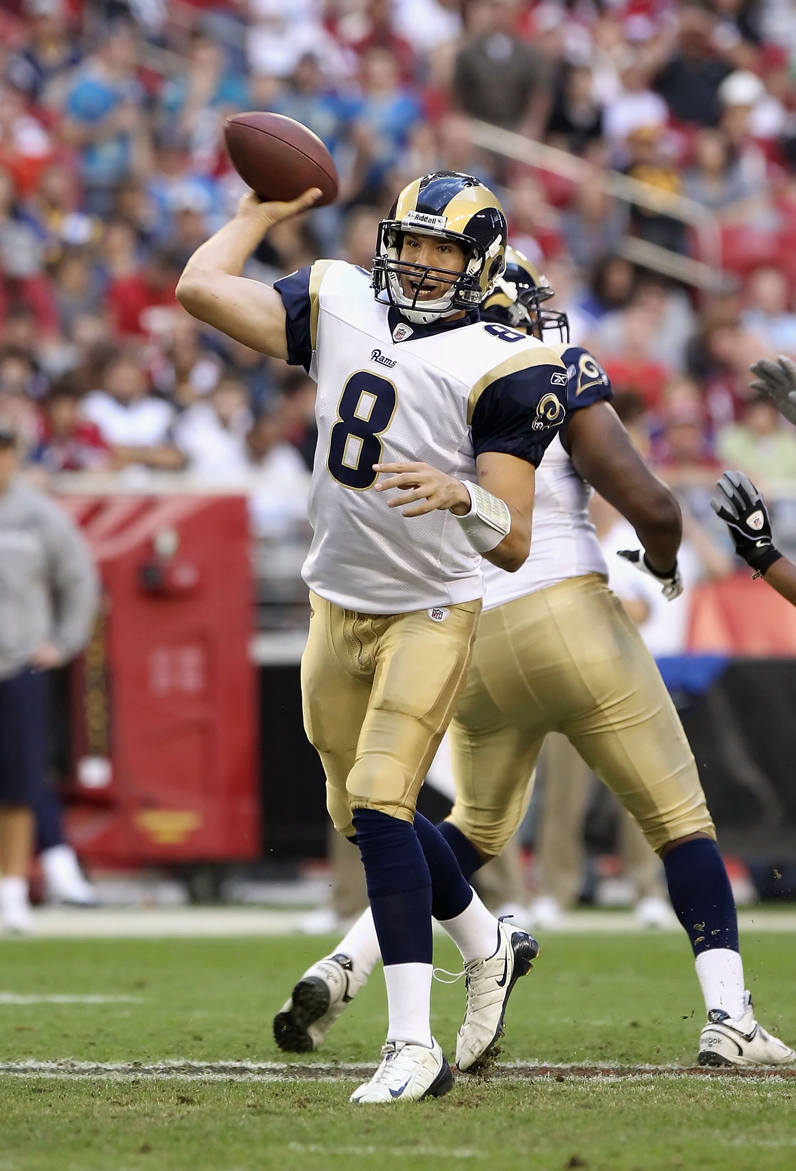 GLENDALE, AZ - DECEMBER 05: Quarterback Sam Bradford #8 of the St. Louis Rams throws the football during the NFL game against the Arizona Cardinals at the University of Phoenix Stadium on December 5, 2010 in Glendale, Arizona. The Rams defeated the Cardi GLENDALE, AZ - DECEMBER 05: Quarterback Sam Bradford #8 of the St. Louis Rams throws the football during the NFL game against the Arizona Cardinals at the University of Phoenix Stadium on December 5, 2010 in Glendale, Arizona. The Rams defeated the Cardi