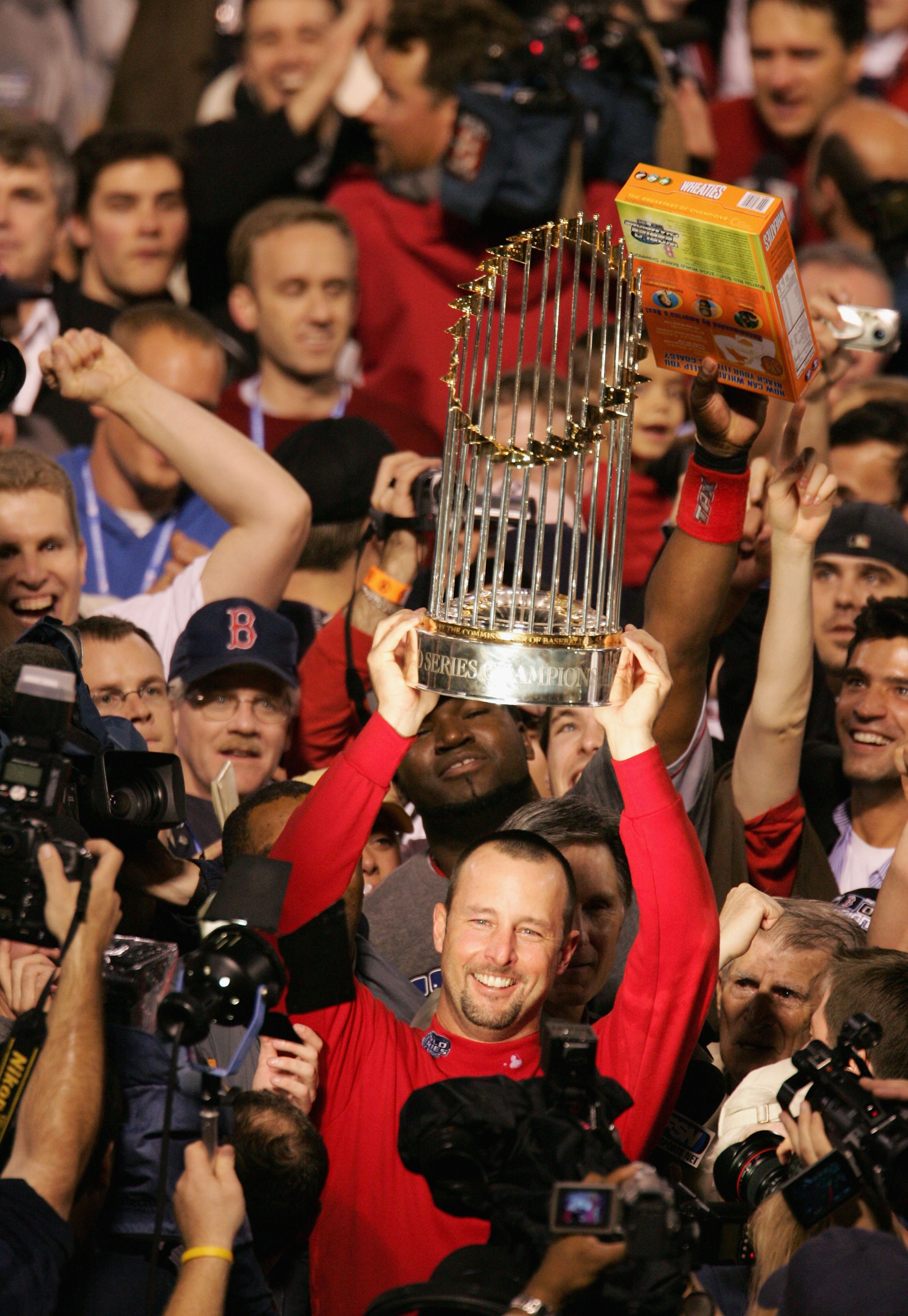 ST LOUIS - OCTOBER 27:  Tim Wakefield #49 of the Boston Red Sox celebrates with the trophy after defeating the St. Louis Cardinals 3-0 in game four of the World Series on October 27, 2004 at Busch Stadium in St. Louis, Missouri. (Photo by Al Bello/Getty I
