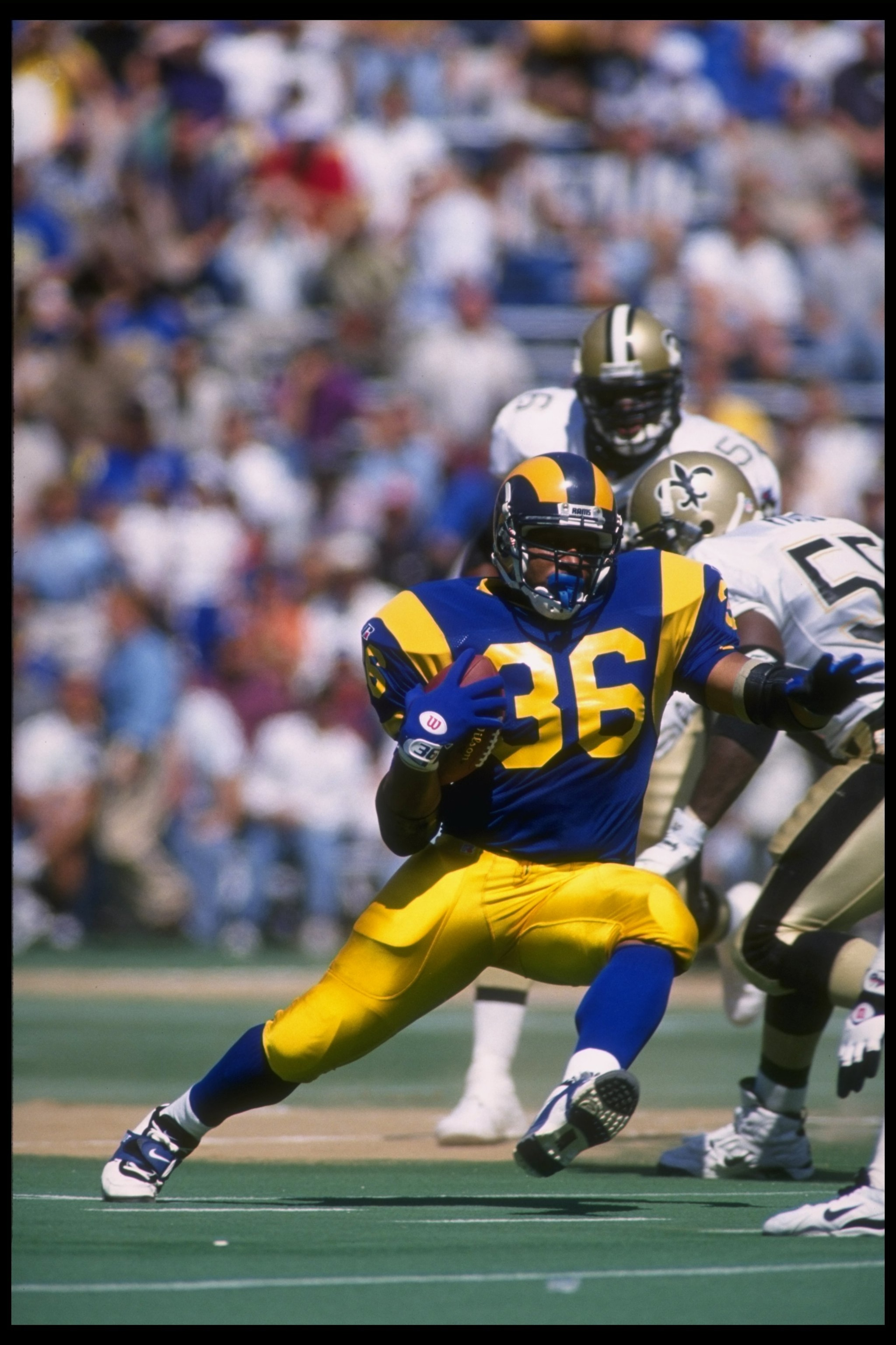10 Sep 1995: Running back Jerome Bettis (center) of the St. Louis Rams runs against the New Orleans Saints during a game played at Busch Stadium in St. Louis, Missouri, The Rams won the game, 17-13.