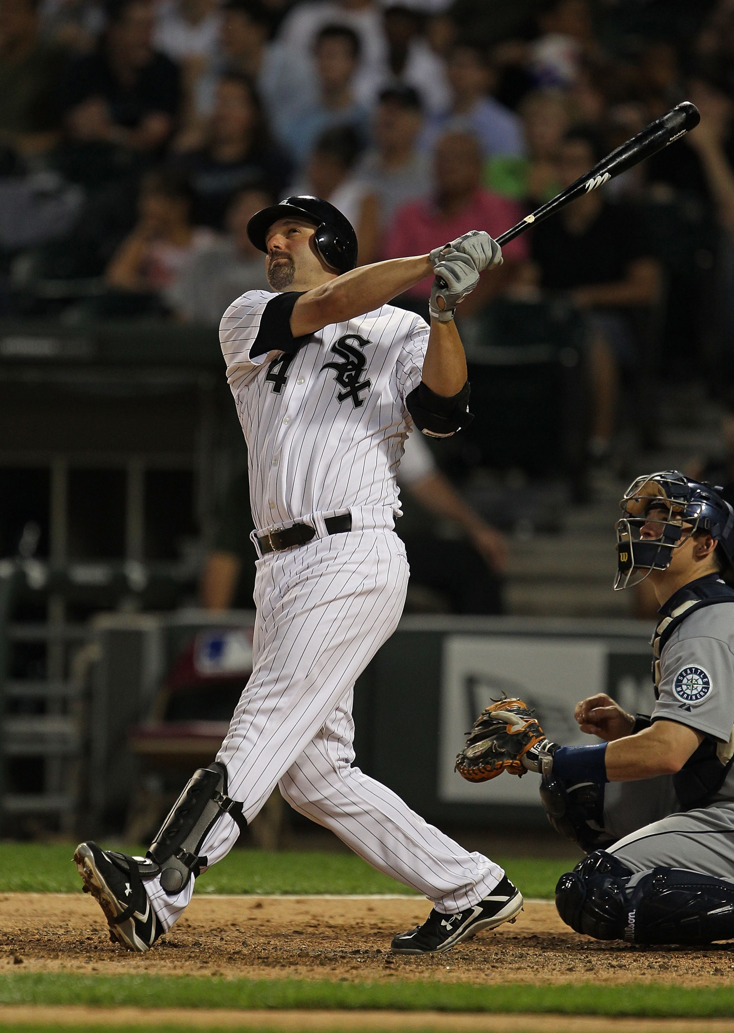 CHICAGO - JULY 26: Paul Konerko #14 of the Chicago White Sox watches the flight of his solo home run in the 6th inning against the Seattle Mariners at U.S. Cellular Field on July 26, 2010 in Chicago, Illinois. The White Sox defeated the Mariners 6-1. (Pho