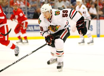 DETROIT - SEPTEMBER 24:  Rob Klinkhammer #59 of the Chicago Blackhawks skates up ice against the Detroit Red Wings during a pre season game on September 24, 2010 at Joe Louis Arena in Detroit, Michigan.  (Photo by Gregory Shamus/Getty Images)