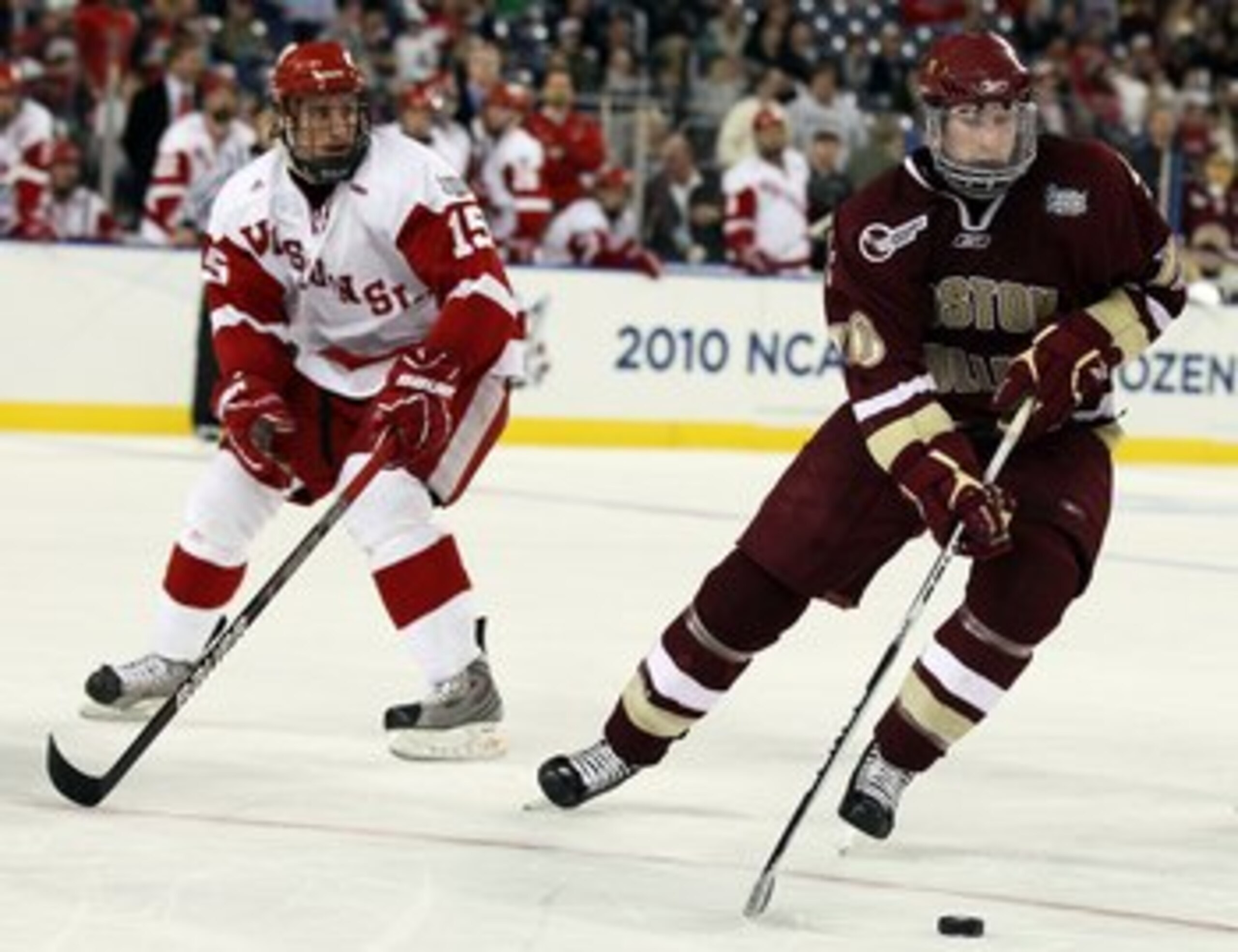 DETROIT - APRIL 10:   Jimmy Hayes #10 of the Boston College Eagles takes the puck as Craig Smith #15 of the Wisconsin Badgers defends during the championship game of the 2010 NCAA Frozen Four on April 10, 2010 at Ford Field in Detroit, Michigan. Boston Co