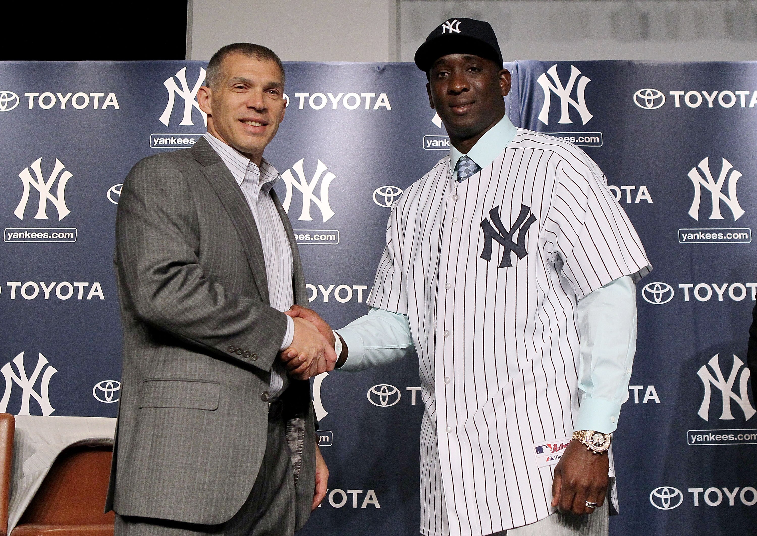NEW YORK, NY - JANUARY 19:  Rafael Sorianoof the New York Yankees shakes hands with manager Joe Girardi during his introduction press conference on January 19, 2011 at Yankee Stadium in the Bronx borough of New York City. The Yankees signed Soriano to a t