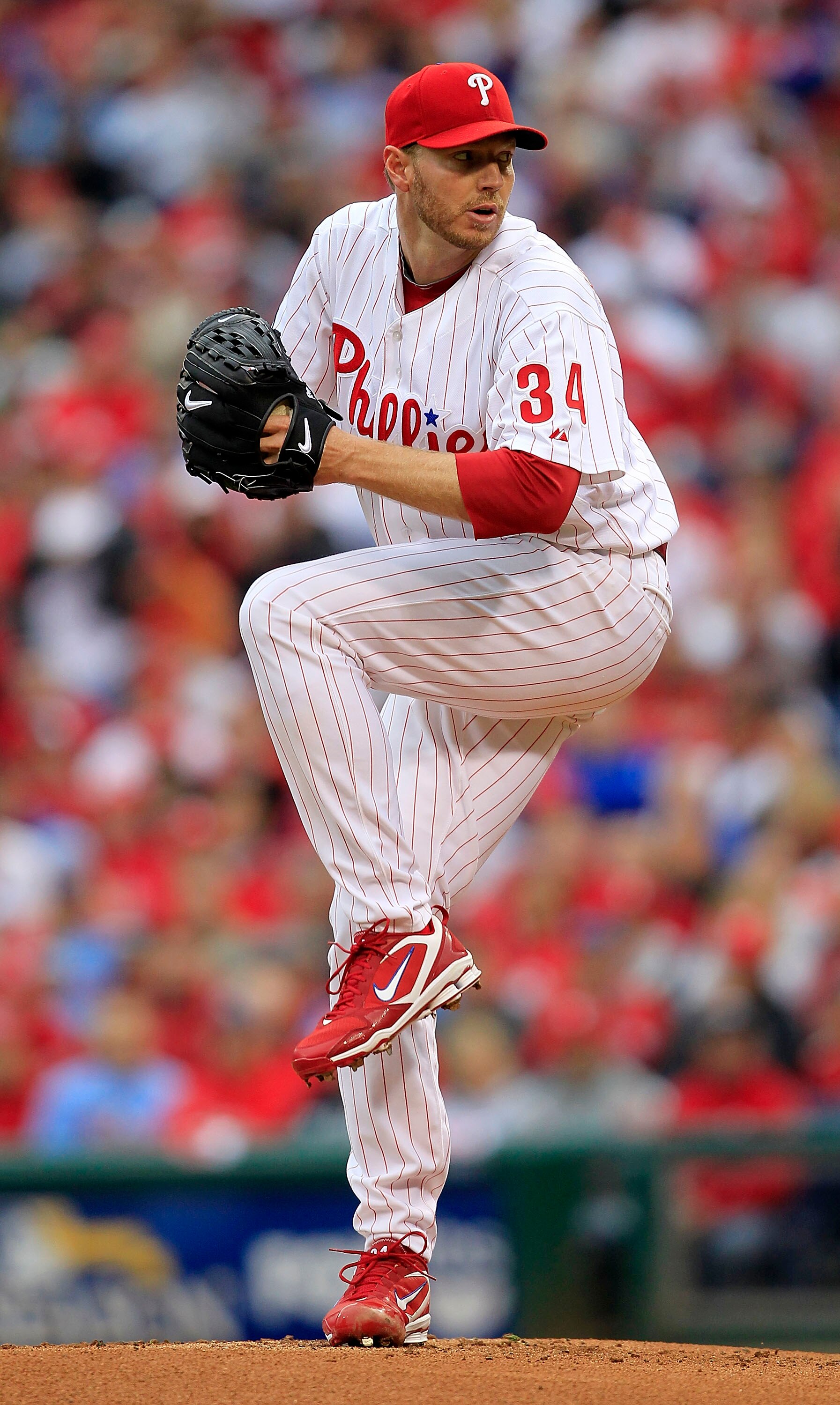 PHILADELPHIA - OCTOBER 06:  Roy Halladay #34 of the Philadelphia Phillies delivers in Game 1 of the NLDS against the Cincinnati Reds at Citizens Bank Park on October 6, 2010 in Philadelphia, Pennsylvania.  (Photo by Chris Trotman/Getty Images)