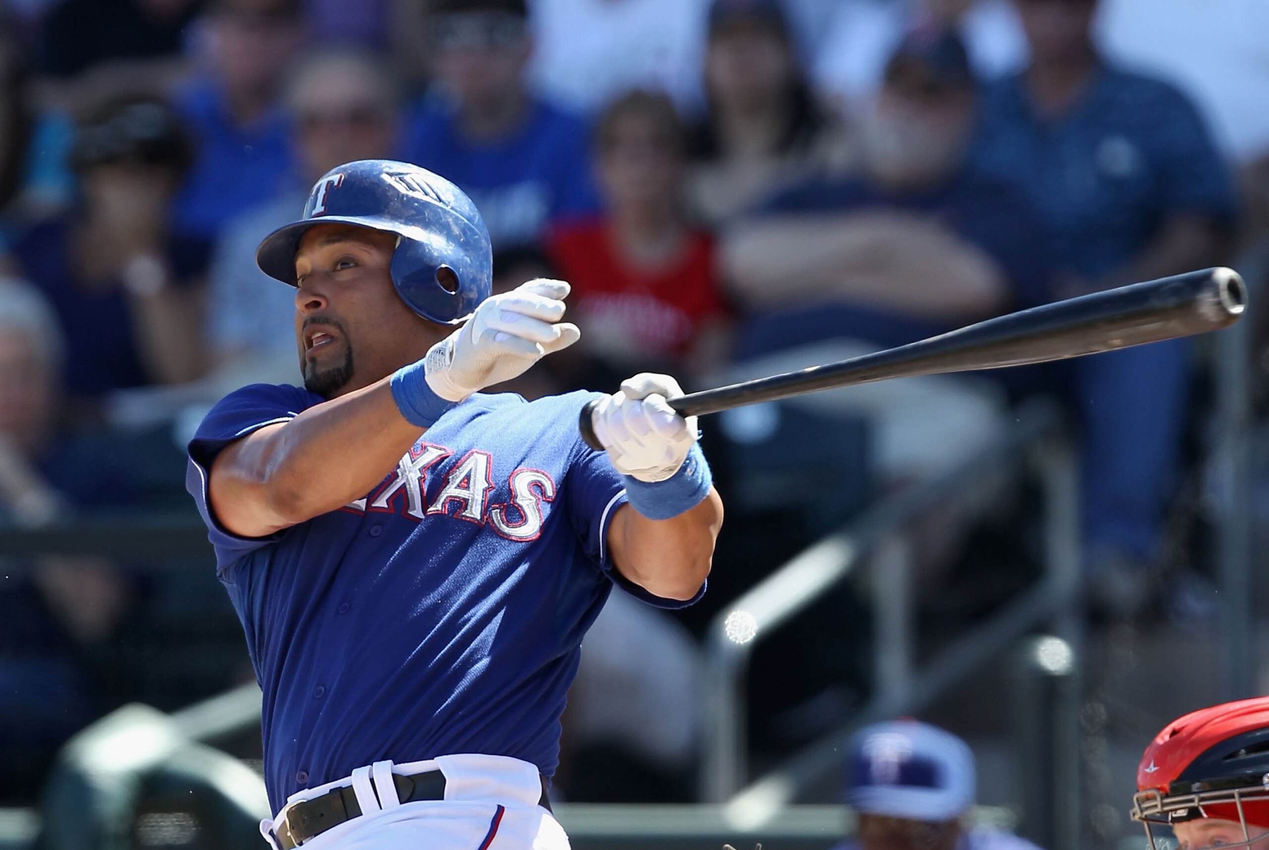 SURPRISE, AZ - MARCH 11:  Yorvit Torrealba #8 of the Texas Rangers bats against the Cincinnati Reds during the spring training game at Surprise Stadium on March 11, 2011 in Surprise, Arizona.  (Photo by Christian Petersen/Getty Images)