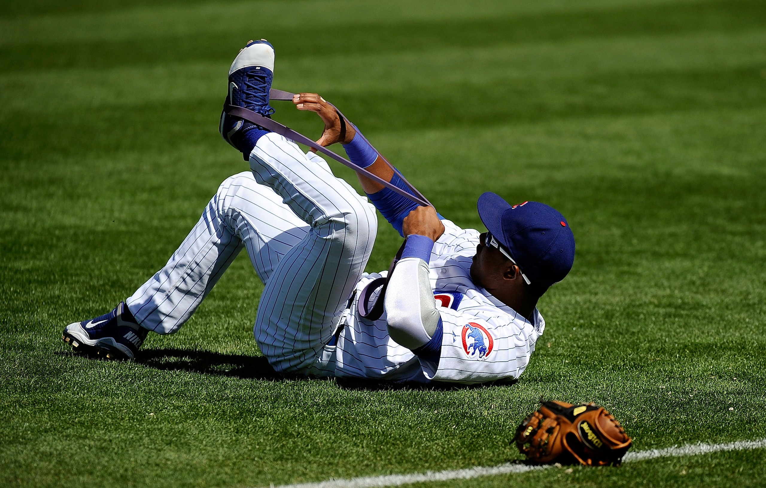 MESA, AZ - MARCH 09:  Starlin Castro #13 of the Chicago Cubs stretches during batting practice before the spring training baseball game against the Kansas City Royals at HoHoKam Stadium on March 9, 2011 in Mesa, Arizona.  (Photo by Kevork Djansezian/Getty