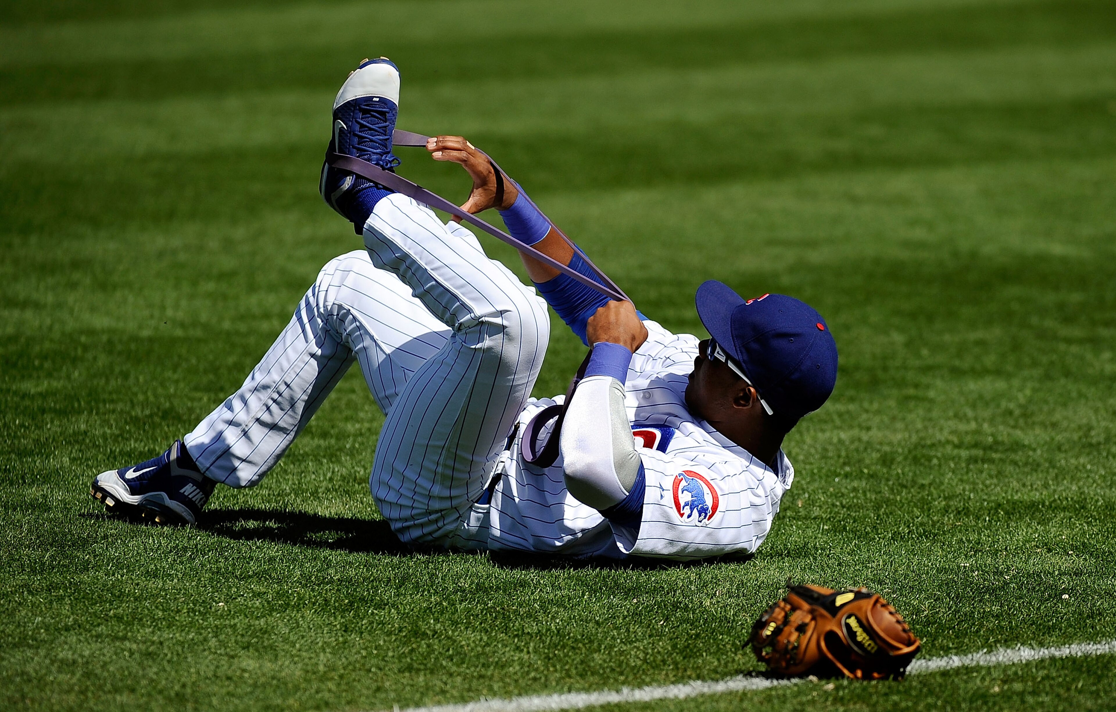 MESA, AZ - MARCH 09:  Starlin Castro #13 of the Chicago Cubs stretches during batting practice before the spring training baseball game against the Kansas City Royals at HoHoKam Stadium on March 9, 2011 in Mesa, Arizona.  (Photo by Kevork Djansezian/Getty