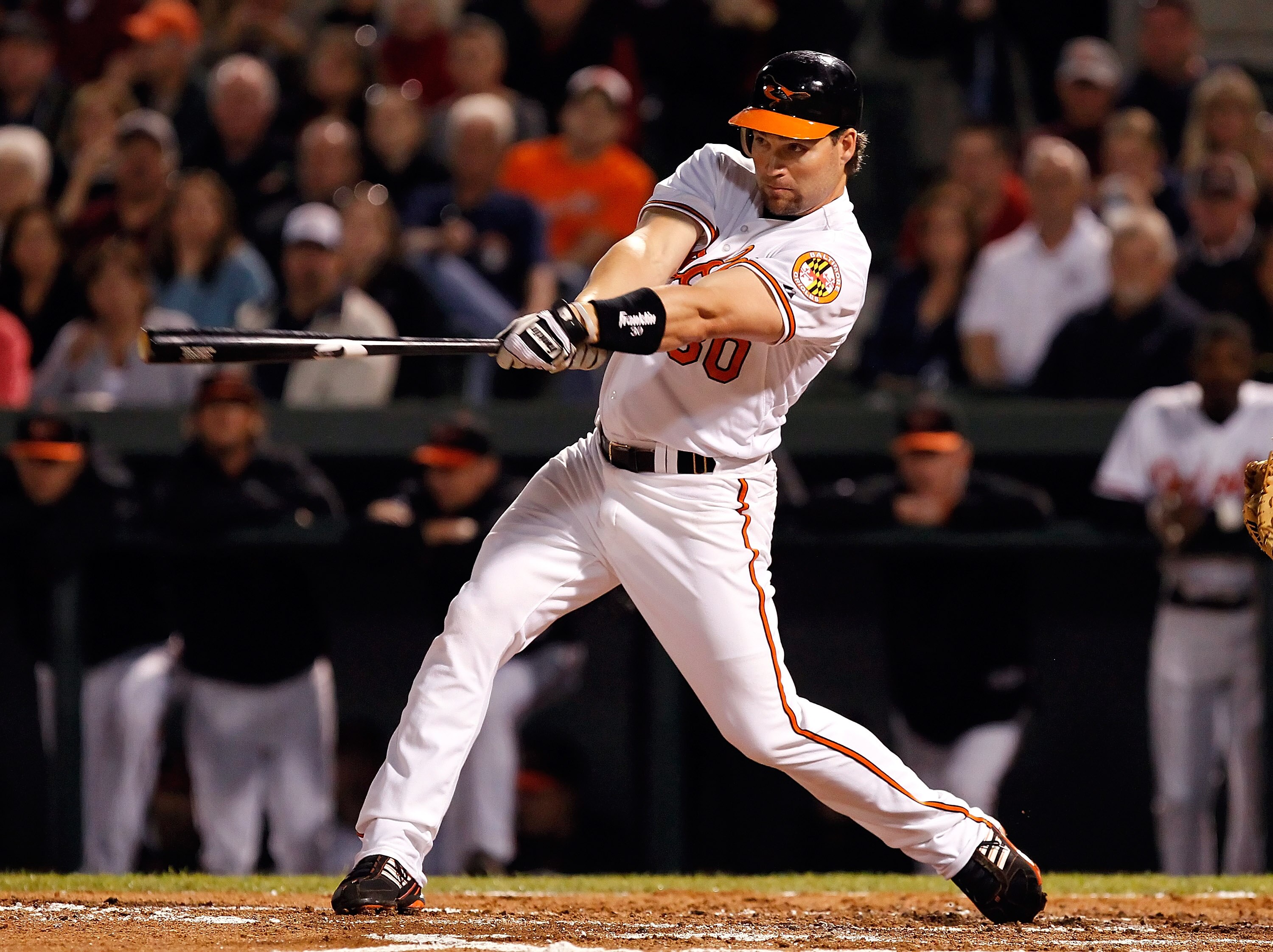 SARASOTA, FL - MARCH 07:  Infielder Luke Scott #30 of the Baltimore Orioles fouls off a pitch against the New York Yankees during a Grapefruit League Spring Training Game at Ed Smith Stadium on March 7, 2011 in Sarasota, Florida.  (Photo by J. Meric/Getty