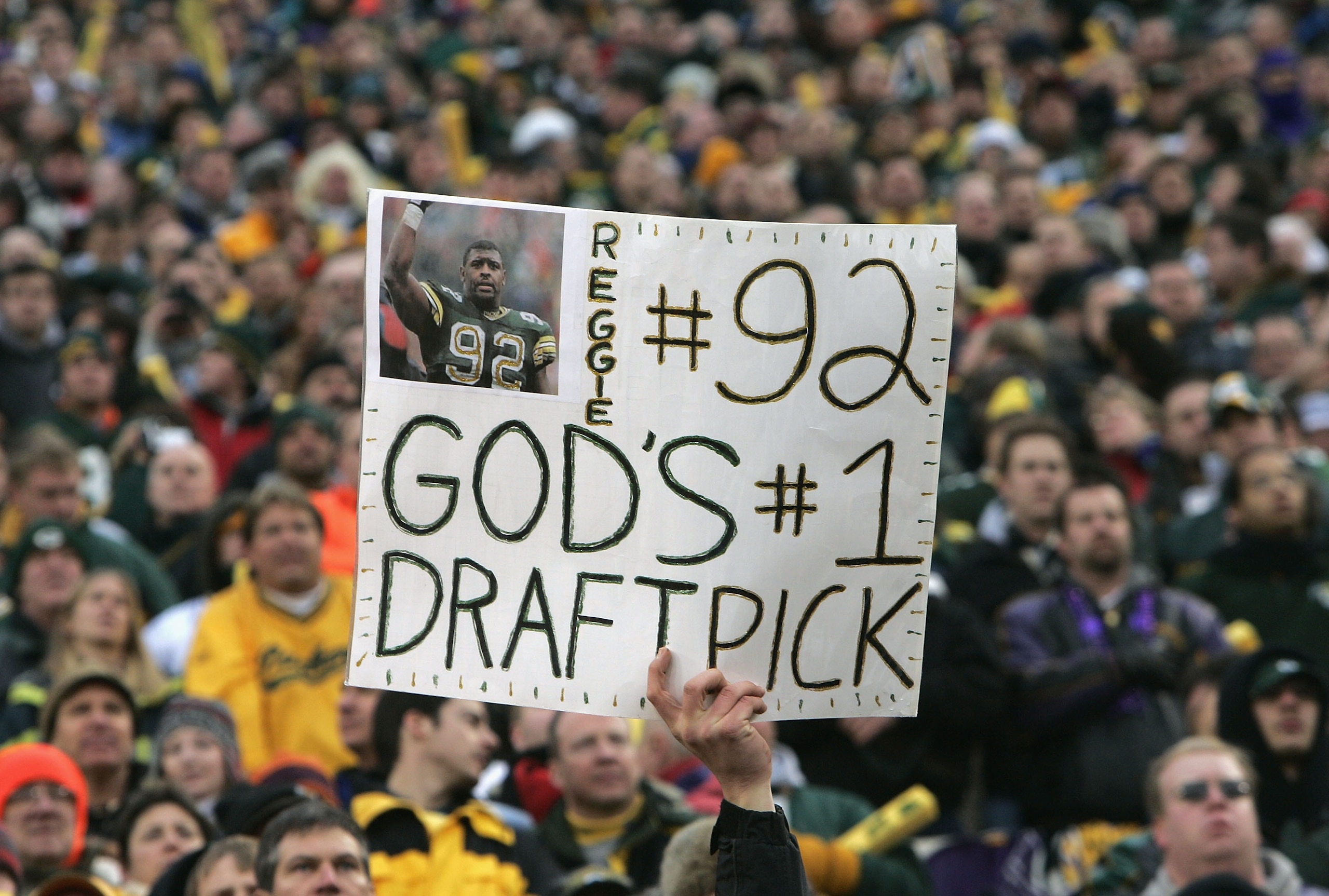 GREEN BAY, WI - JANUARY 9: Fans show their support for former Packer Reggie White as the Minnesota Vikings take on the Green Bay Packers in the NFC wild-card game at Lambeau Field on January 9, 2005 in Green Bay, Wisconsin. The Vikings defeated the Pack GREEN BAY, WI - JANUARY 9: Fans show their support for former Packer Reggie White as the Minnesota Vikings take on the Green Bay Packers in the NFC wild-card game at Lambeau Field on January 9, 2005 in Green Bay, Wisconsin. The Vikings defeated the Pack
