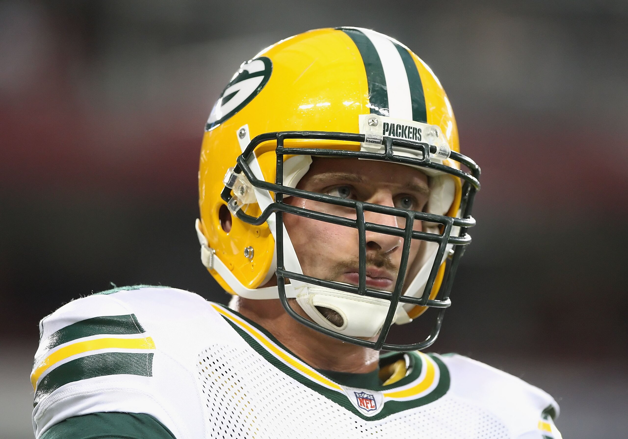 GLENDALE, AZ - AUGUST 28: Linebacker Aaron Kampman #74 of the Green Bay Packers warms up before the NFL game against the Arizona Cardinals at the University of Phoenix Stadium on August 28, 2009 in Glendale, Arizona. The Packers defeated the Cardinals 44 GLENDALE, AZ - AUGUST 28: Linebacker Aaron Kampman #74 of the Green Bay Packers warms up before the NFL game against the Arizona Cardinals at the University of Phoenix Stadium on August 28, 2009 in Glendale, Arizona. The Packers defeated the Cardinals 44