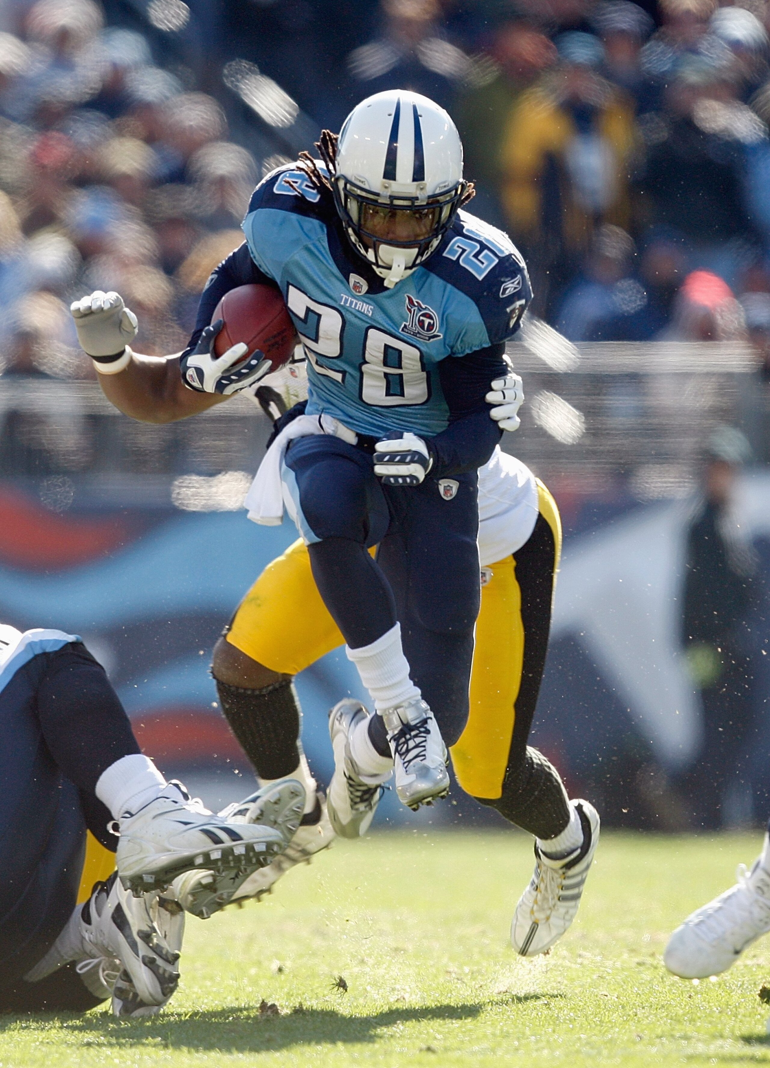 NASHVILLE,TN - DECEMBER 21:  Chris Johnson #28 of the Tennessee Titans carries the ball up the middle during the game against the Pittsburgh Steelers on December 21, 2008 at LP Field in Nashville, Tennessee. (Photo by: Streeter Lecka/Getty Images)