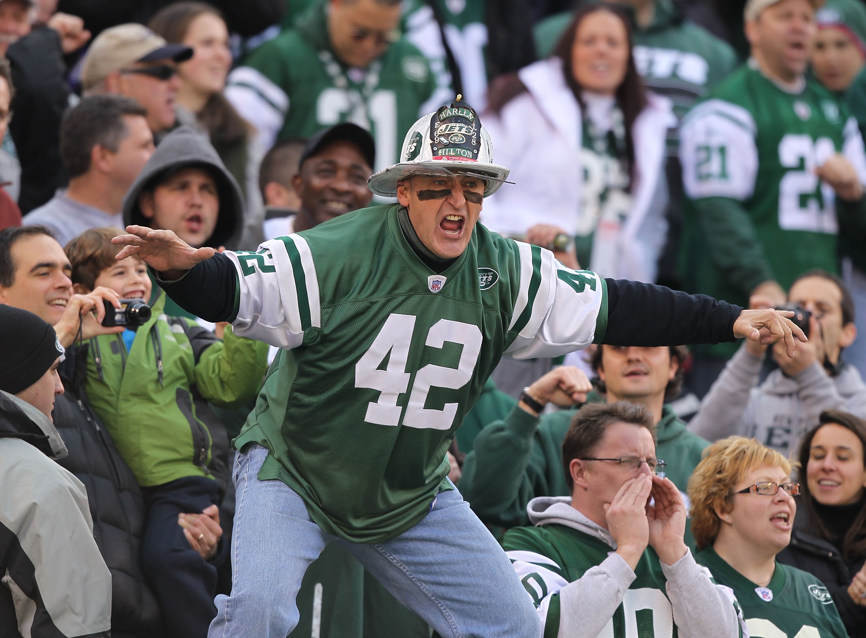 EAST RUTHERFORD, NJ - NOVEMBER 21: Ed Anzalone, alias Fireman Eddie, super fan of the New York Jets leads a cheer against the Houston Texans during their game on November21, 2010 at the New Meadowlands Stadium in East Rutherford, New Jersey. (Photo b EAST RUTHERFORD, NJ - NOVEMBER 21: Ed Anzalone, alias Fireman Eddie, super fan of the New York Jets leads a cheer against the Houston Texans during their game on November21, 2010 at the New Meadowlands Stadium in East Rutherford, New Jersey. (Photo b
