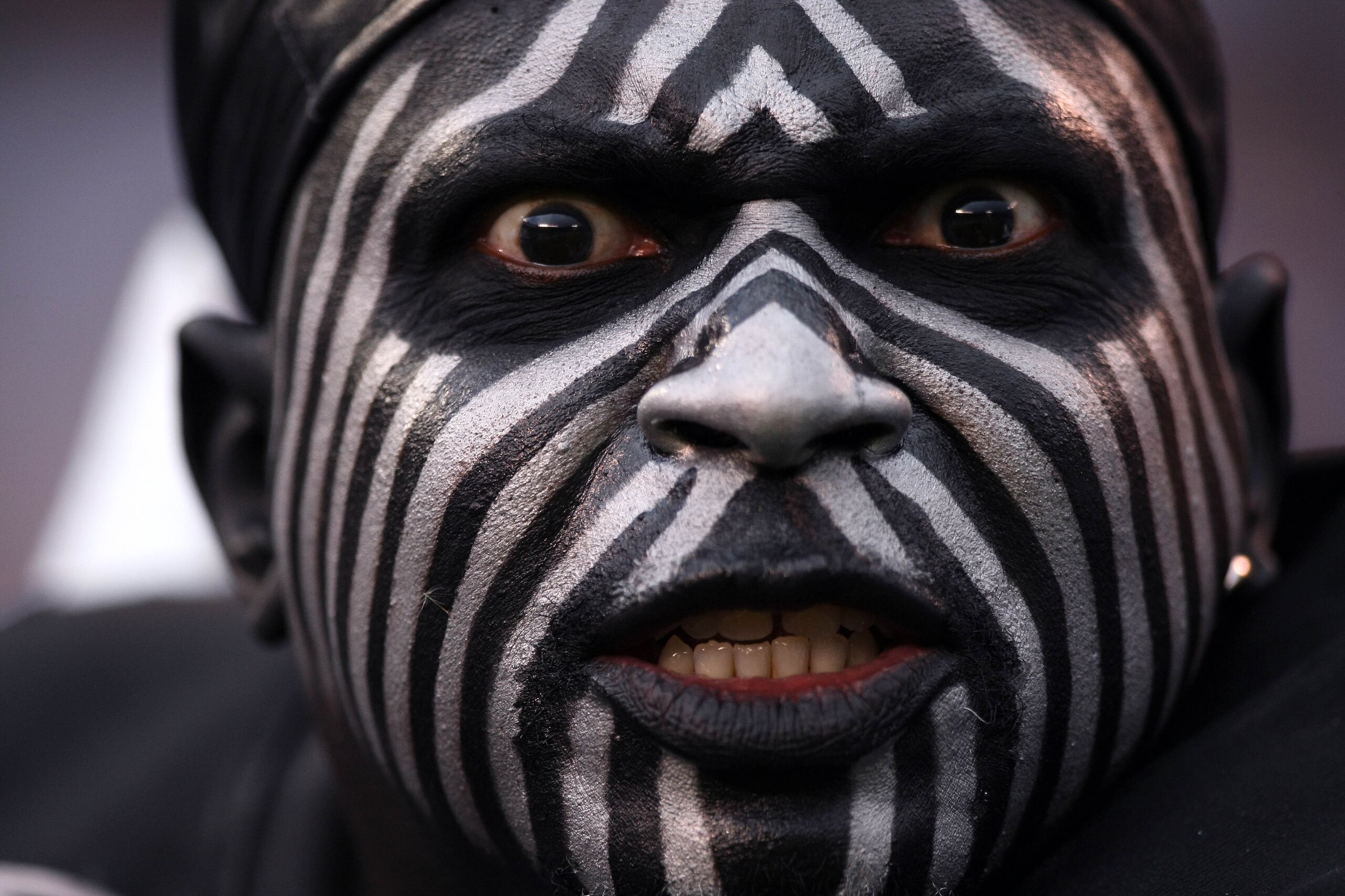 SAN DIEGO, CA - DECEMBER 5: A fan of the Oakland Raiders looks on during their NFL game at Qualcomm Stadium on December 5, 2010 in San Diego, California. (Photo by Donald Miralle/Getty Images) SAN DIEGO, CA - DECEMBER 5: A fan of the Oakland Raiders looks on during their NFL game at Qualcomm Stadium on December 5, 2010 in San Diego, California. (Photo by Donald Miralle/Getty Images)