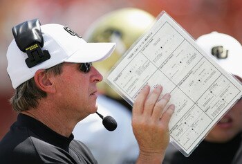MIAMI - SEPTEMBER 24:  Head coach Gary Barnett of the Colorado Buffaloes hides his face using a play sheet as he calls plays into his team against the Miami Hurricanes on September 24, 2005 in Miami, Florida. Miami defeated Colorad 23-3.  (Photo by Doug B