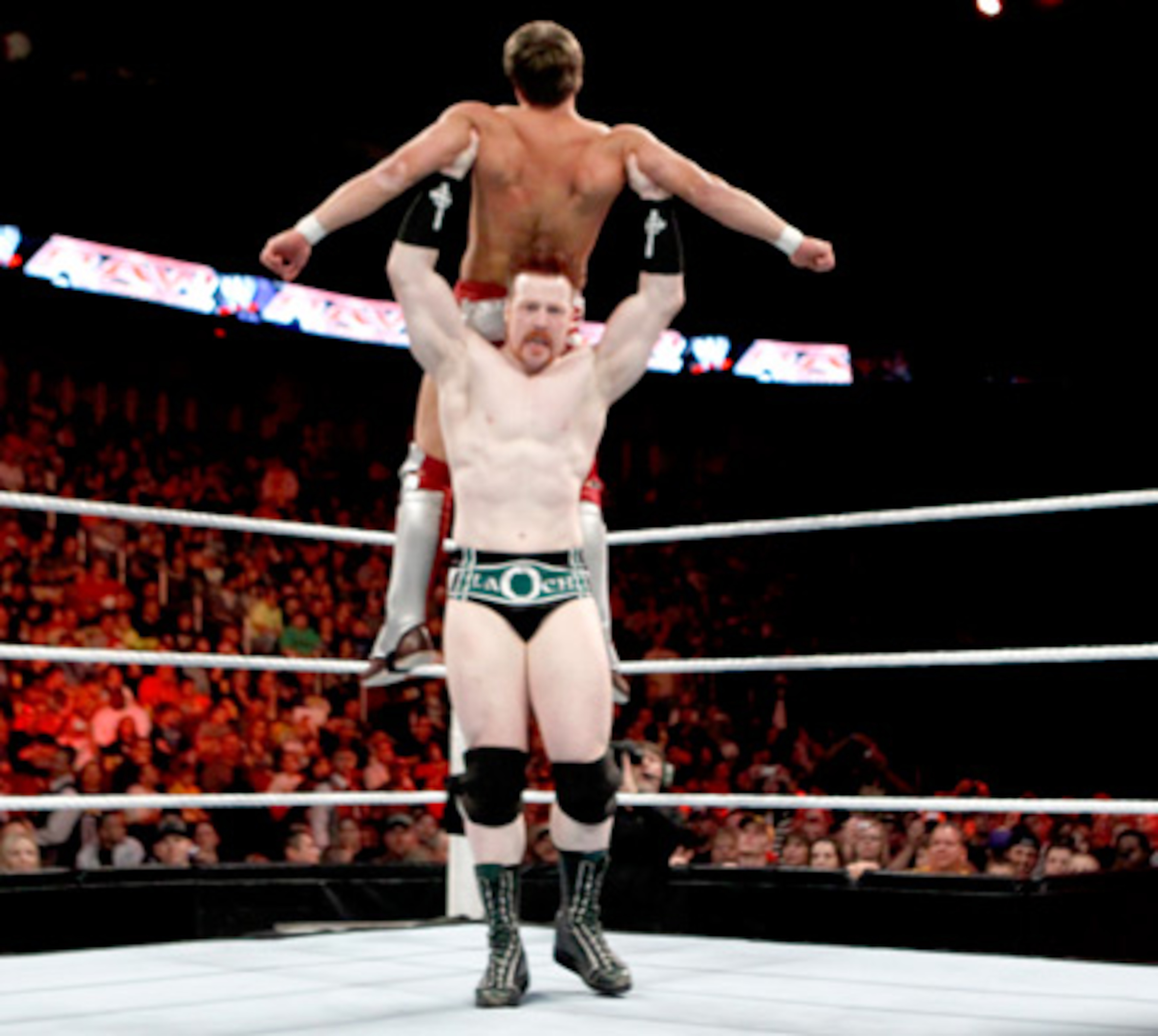 Sheamus looks to hit the High Cross on a dazed Daniel Bryan.