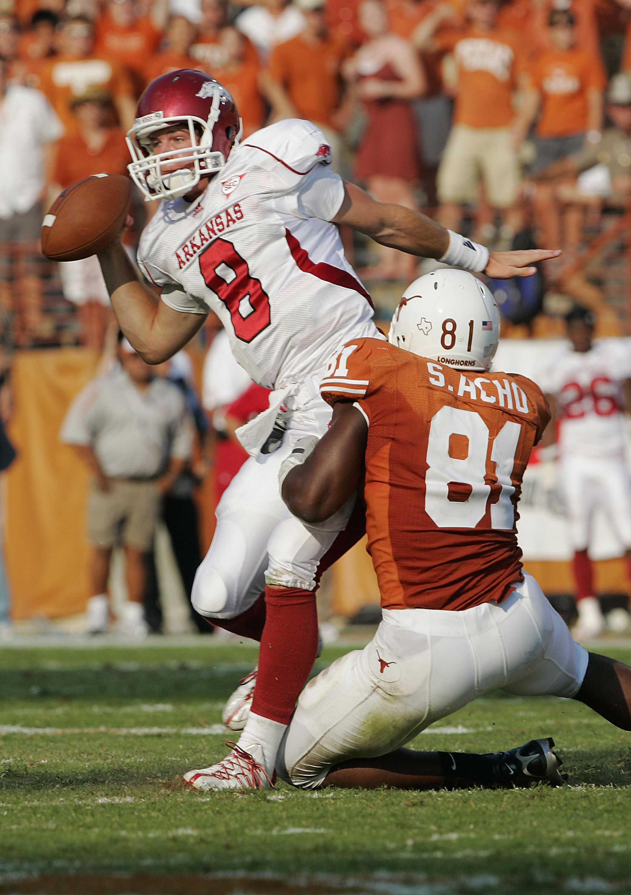 AUSTIN, TX - SEPTEMBER 27:  Defensive end Sam Acho #81 of the Texas Longhorns sacks quarterback Tyler Wilson #8 of the Arkansas Razorbacks on September 27, 2008 at Darrell K Royal-Texas Memorial Stadium in Austin, Texas.  (Photo by Brian Bahr/Getty Images