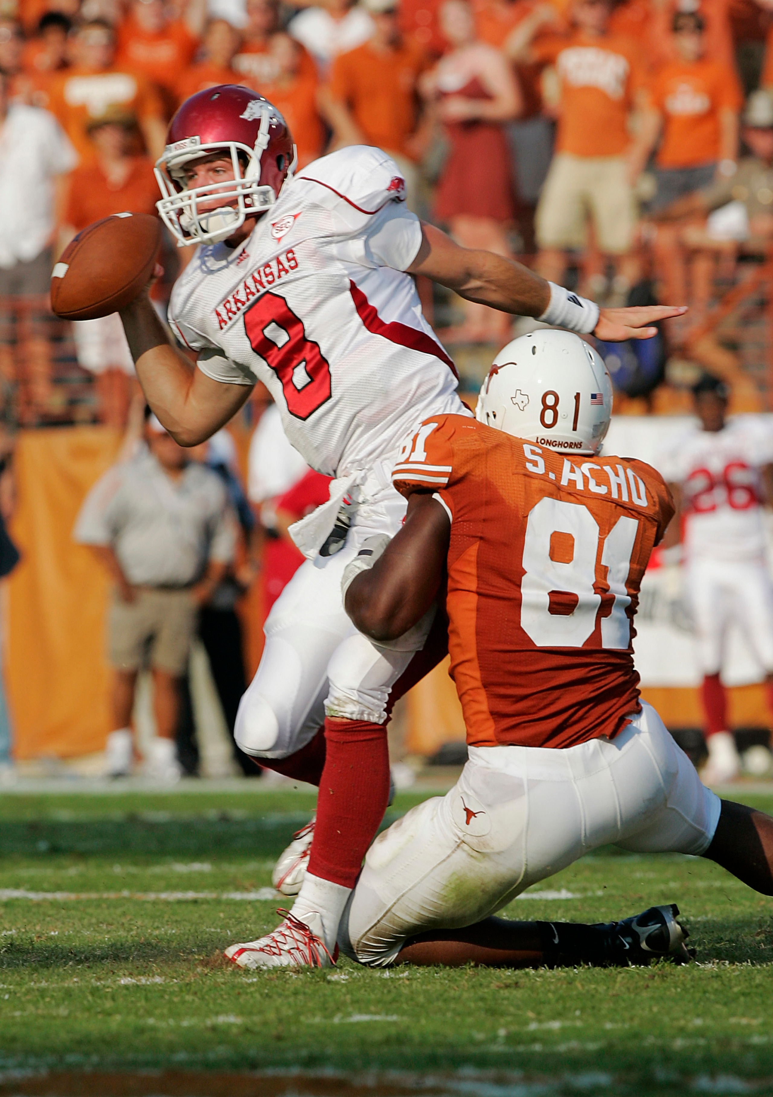 AUSTIN, TX - SEPTEMBER 27:  Defensive end Sam Acho #81 of the Texas Longhorns sacks quarterback Tyler Wilson #8 of the Arkansas Razorbacks on September 27, 2008 at Darrell K Royal-Texas Memorial Stadium in Austin, Texas.  (Photo by Brian Bahr/Getty Images