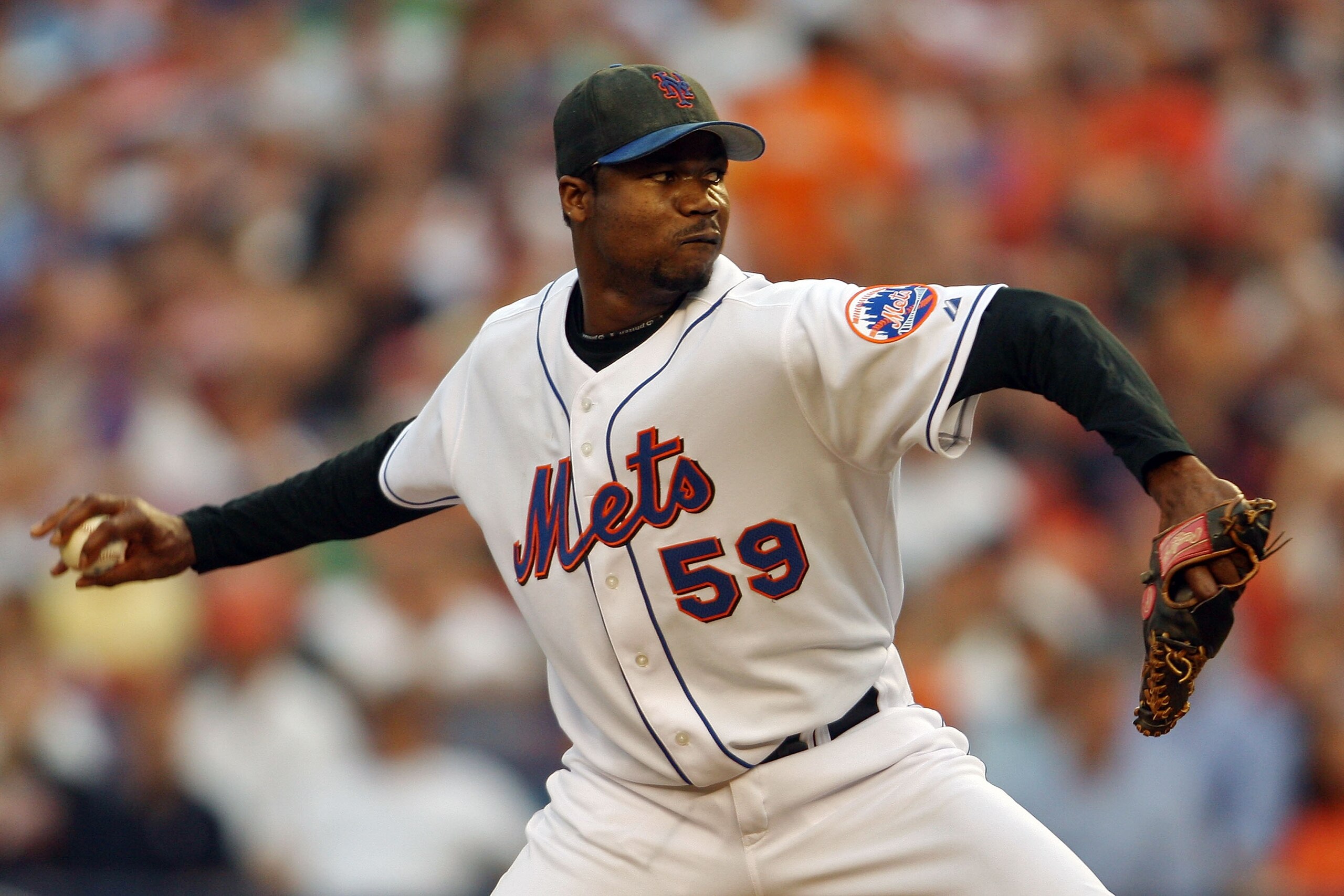NEW YORK - OCTOBER 04:  Guillermo Mota #59 of the New York Mets pitches against the Los Angeles Dodgers during game one of the National League Division Series at Shea Stadium on October 4, 2006 in the Flushing neighborhood of Queens borough of New York Ci