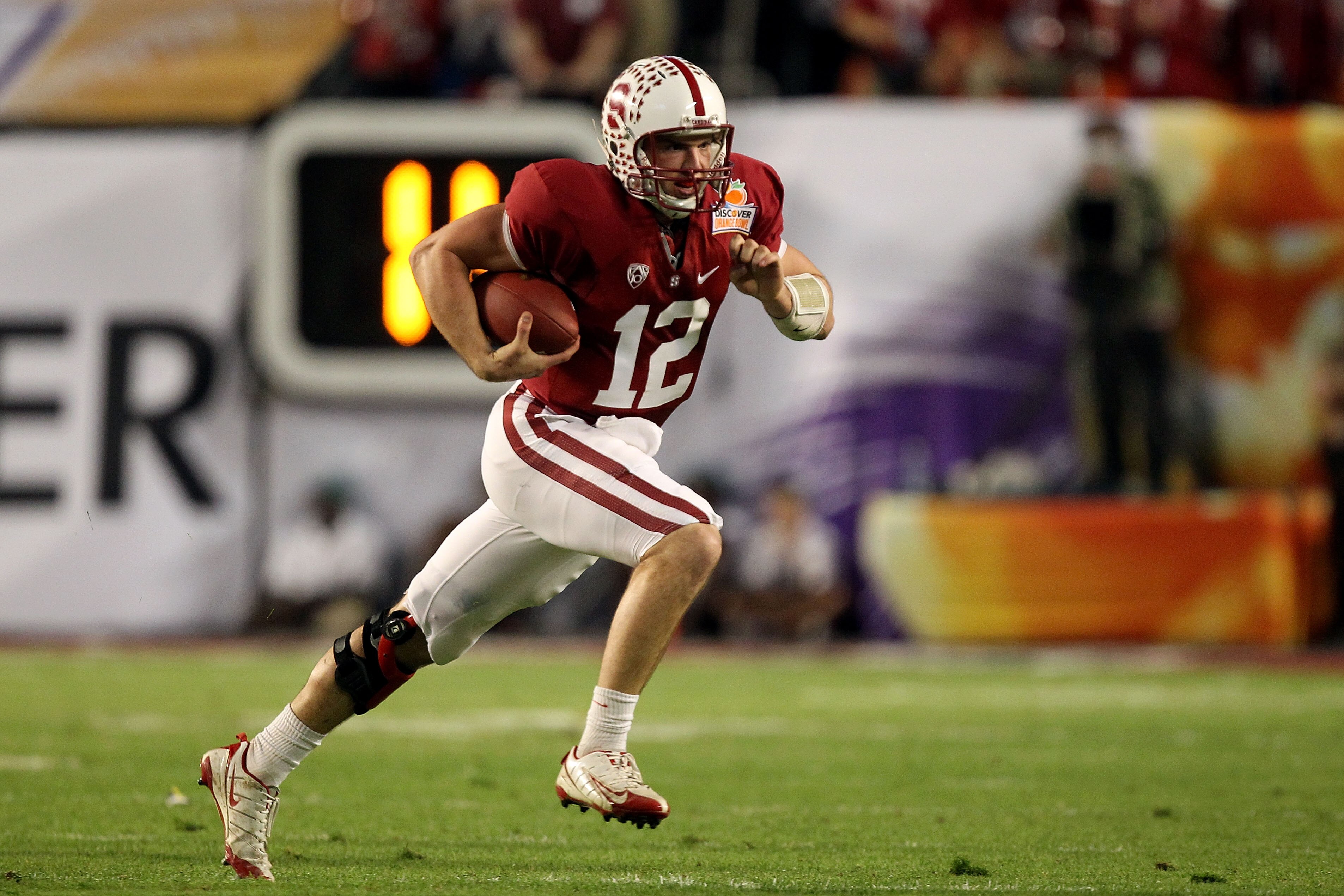 MIAMI, FL - JANUARY 03: Quarterback Andrew Luck #12 of the Stanford Cardinal runs with the ball against the Virginia Tech Hokies during the 2011 Discover Orange Bowl at Sun Life Stadium on January 3, 2011 in Miami, Florida. Stanford won 40-12. (Photo by MIAMI, FL - JANUARY 03: Quarterback Andrew Luck #12 of the Stanford Cardinal runs with the ball against the Virginia Tech Hokies during the 2011 Discover Orange Bowl at Sun Life Stadium on January 3, 2011 in Miami, Florida. Stanford won 40-12. (Photo by