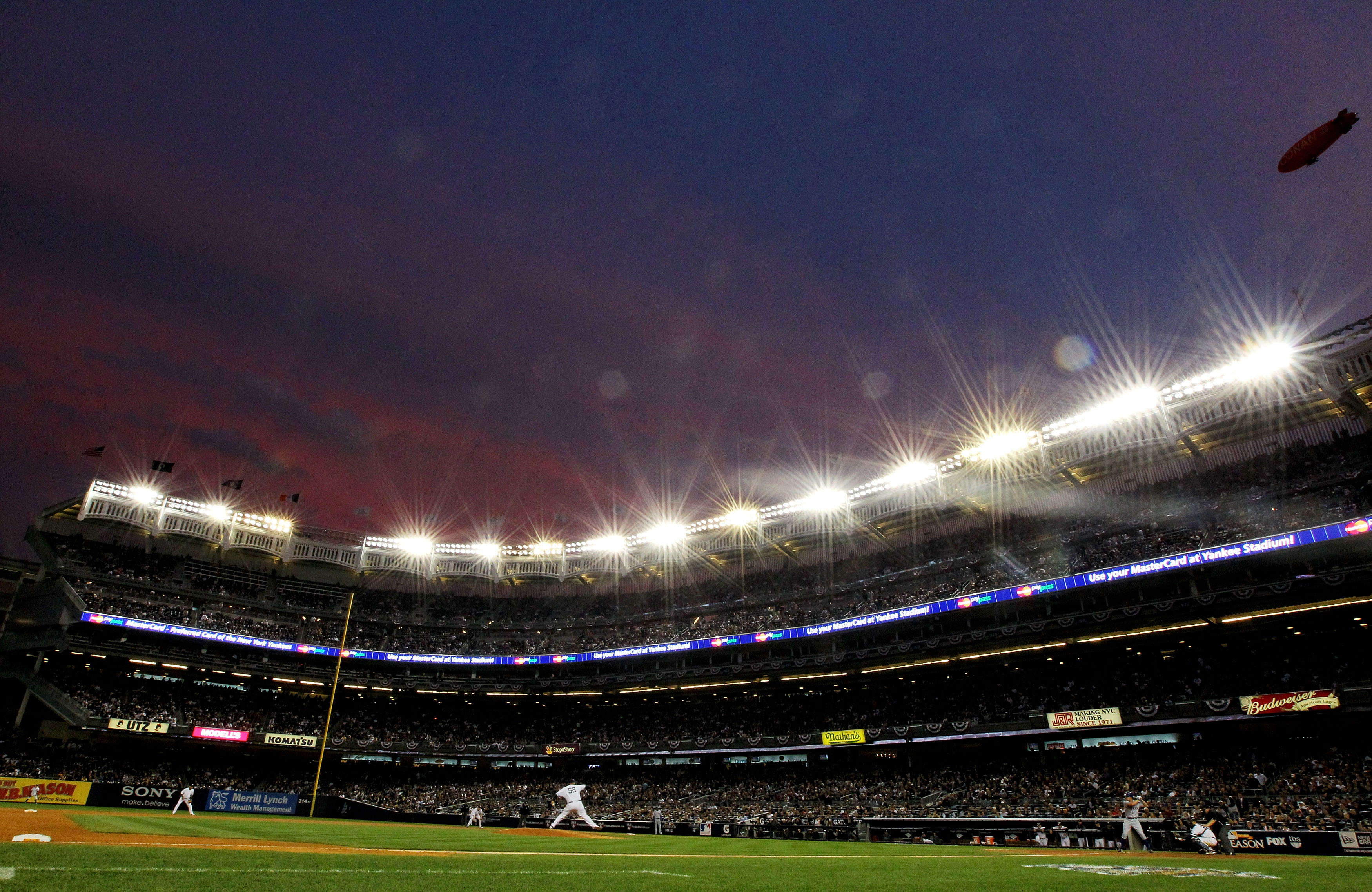 NEW YORK - OCTOBER 20:  CC Sabathia #52 of the New York Yankees pitches against the Texas Rangers in Game Five of the ALCS during the 2010 MLB Playoffs at Yankee Stadium on October 20, 2010 in the Bronx borough of New York City.  (Photo by Al Bello/Getty