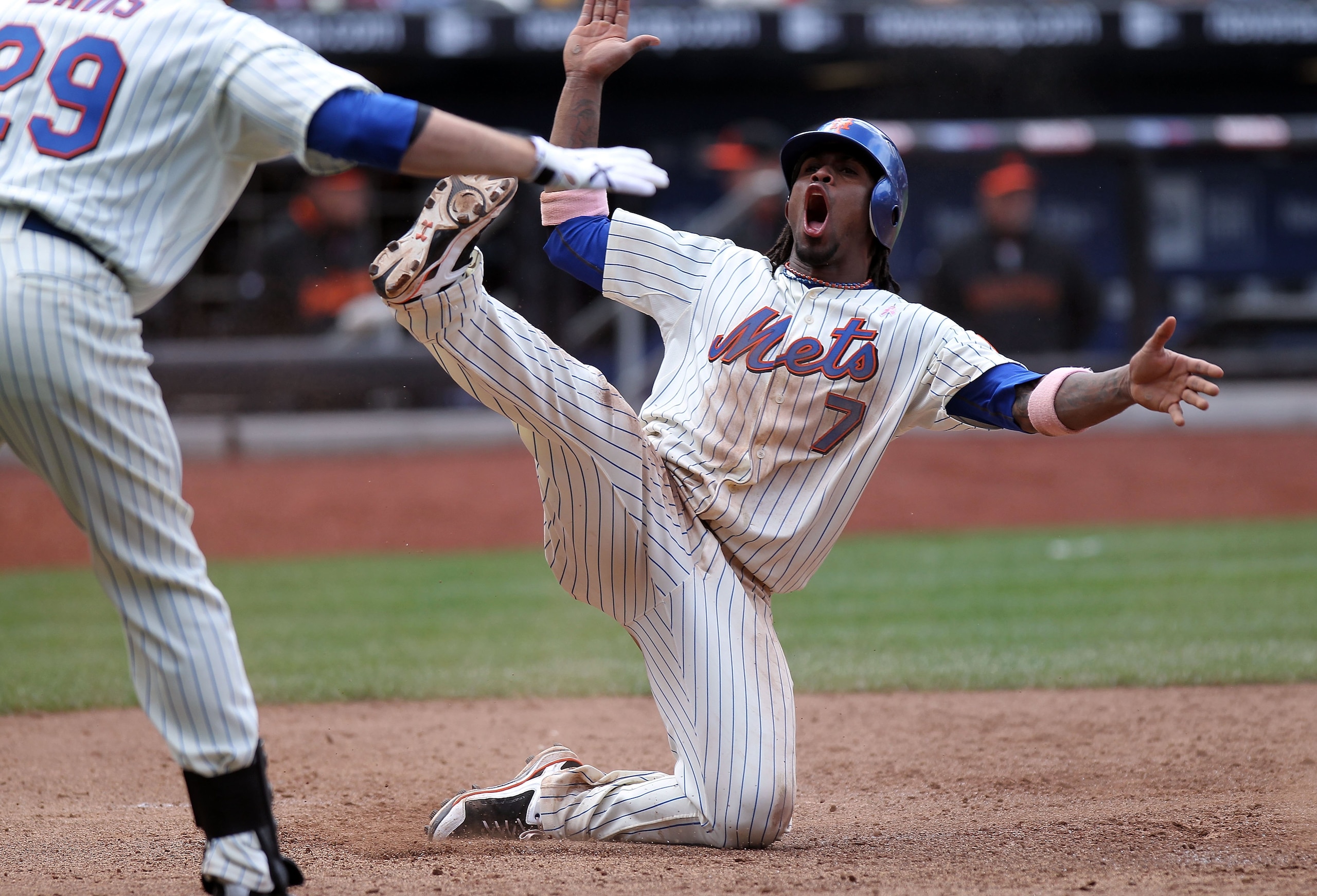 NEW YORK - MAY 09:  Jose Reyes #7 of the New York Mets scores on a David Wright sacrifice fly against the San Francisco Giants at Citi Field on May 9, 2010 in the Flushing neighborhood of the Queens borough of New York City.  (Photo by Nick Laham/Getty Im