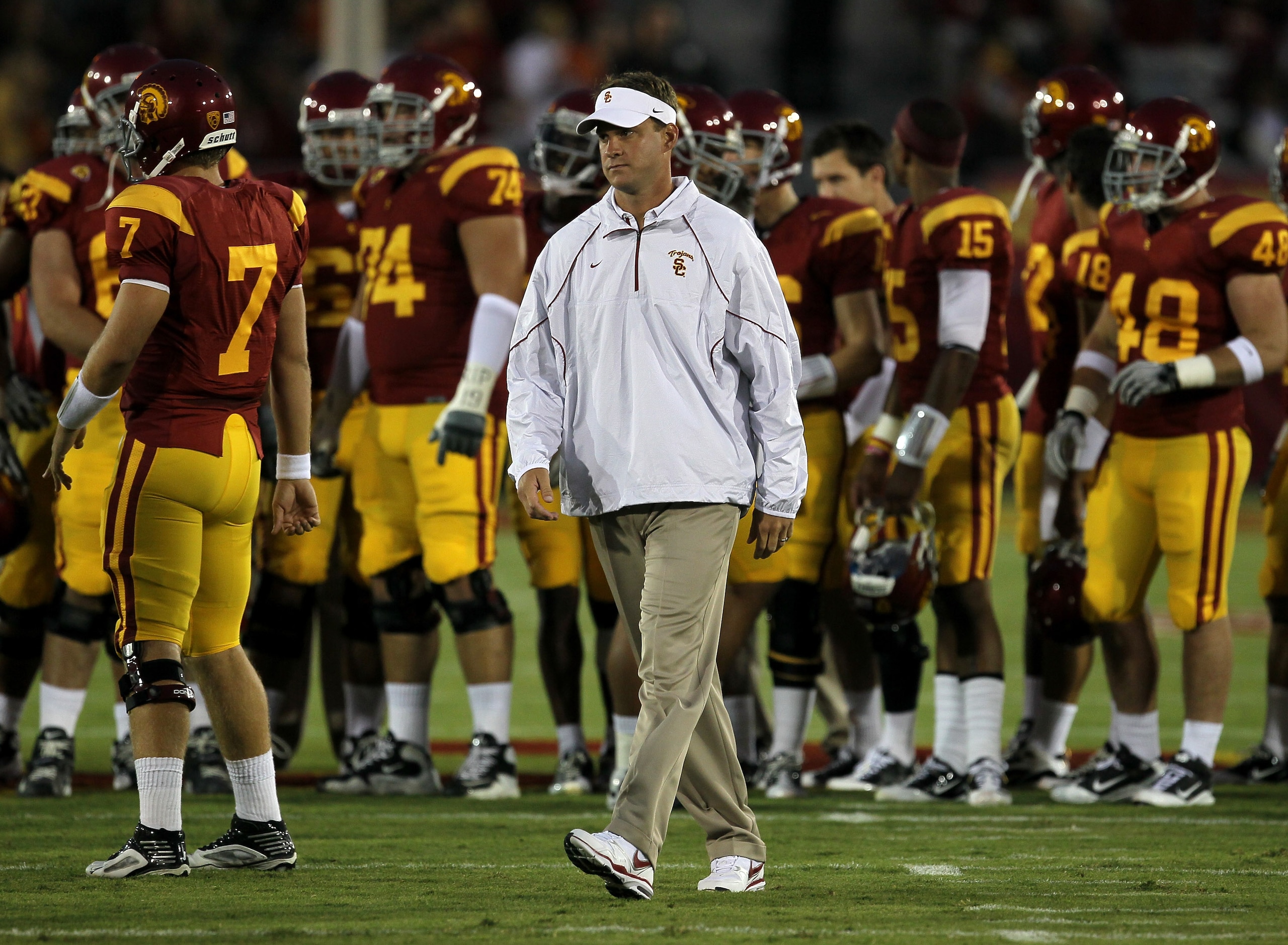 LOS ANGELES, CA - SEPTEMBER 11:  Head coach Lane Kiffin watches the USC Trojans warm up for their game with the Virginia Cavaliers at Los Angeles Memorial Coliseum on September 11, 2010 in Los Angeles, California.  (Photo by Stephen Dunn/Getty Images)