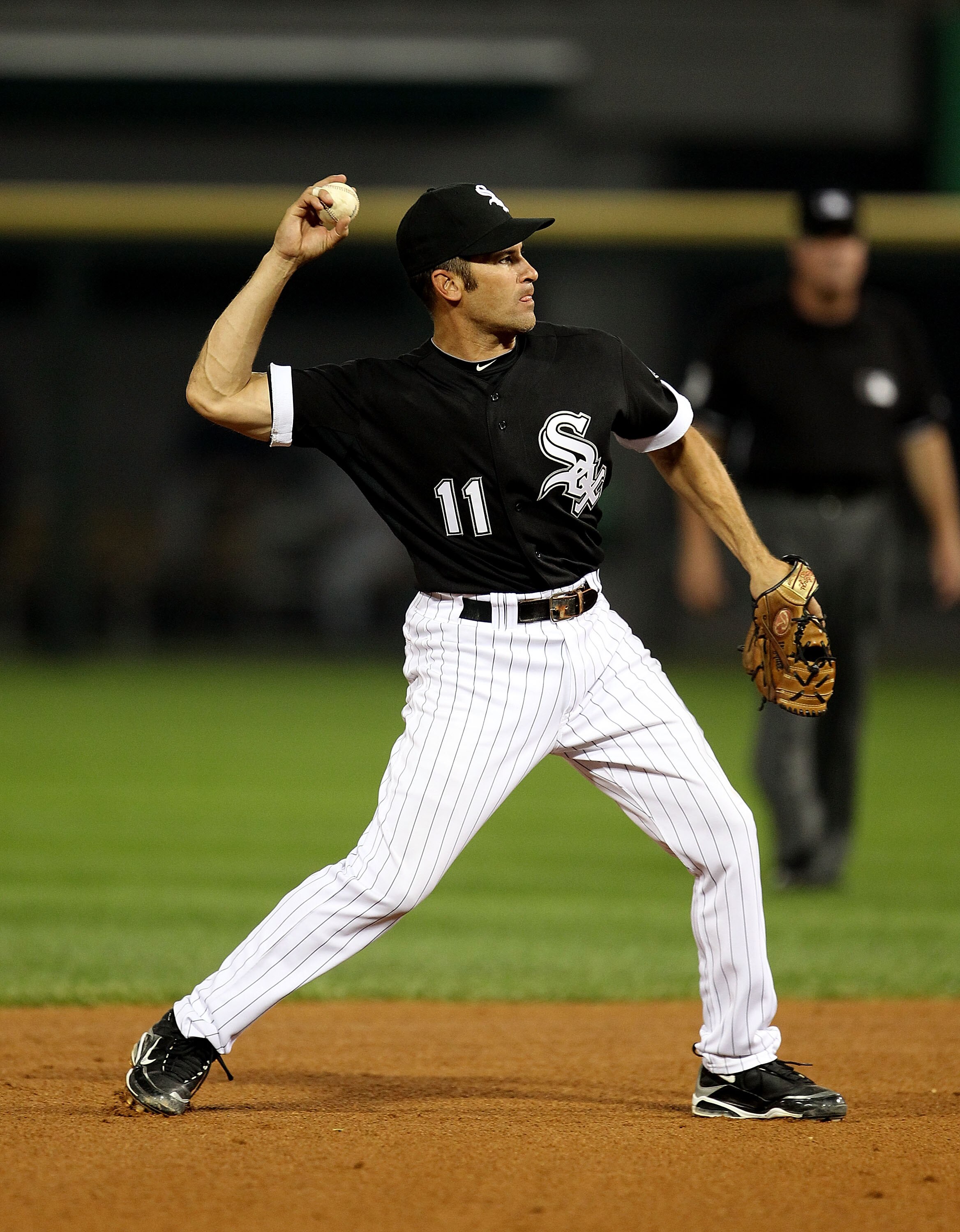 CHICAGO - AUGUST 10:Omar Vizquel #11 of the Chicago White Sox throws the ball to 1st base against the Minnesota Twins at U.S. Cellular Field on August 10, 2010 in Chicago, Illinois. The Twins defeated the White Sox 12-6. (Photo by Jonathan Daniel/Getty Im