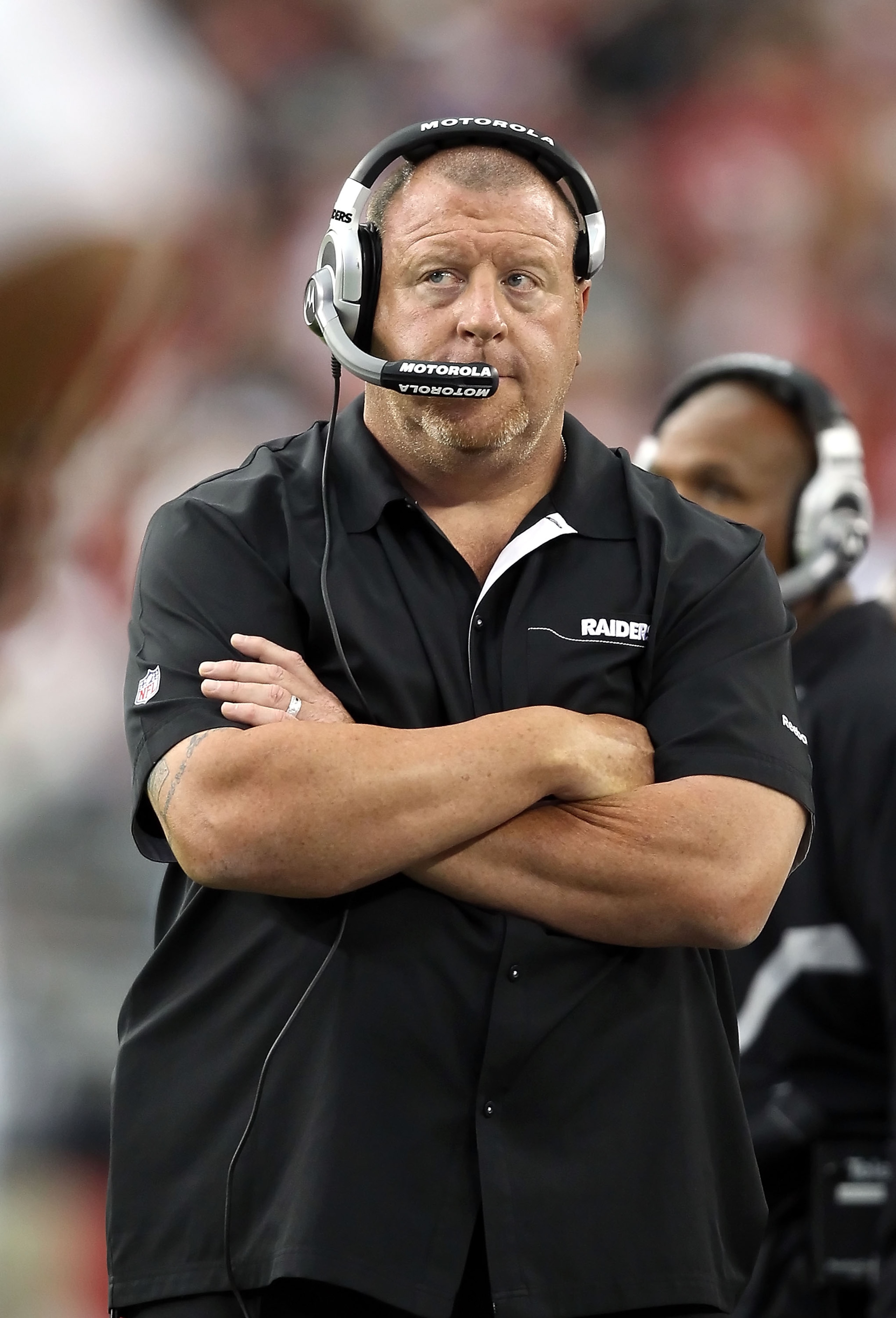 GLENDALE, AZ - SEPTEMBER 26:  Head coach Tom Cable of the Oakland Raiders stands on the sidelines during the NFL game against the Arizona Cardinals at the University of Phoenix Stadium on September 26, 2010 in Glendale, Arizona.  The Cardinals defeated th