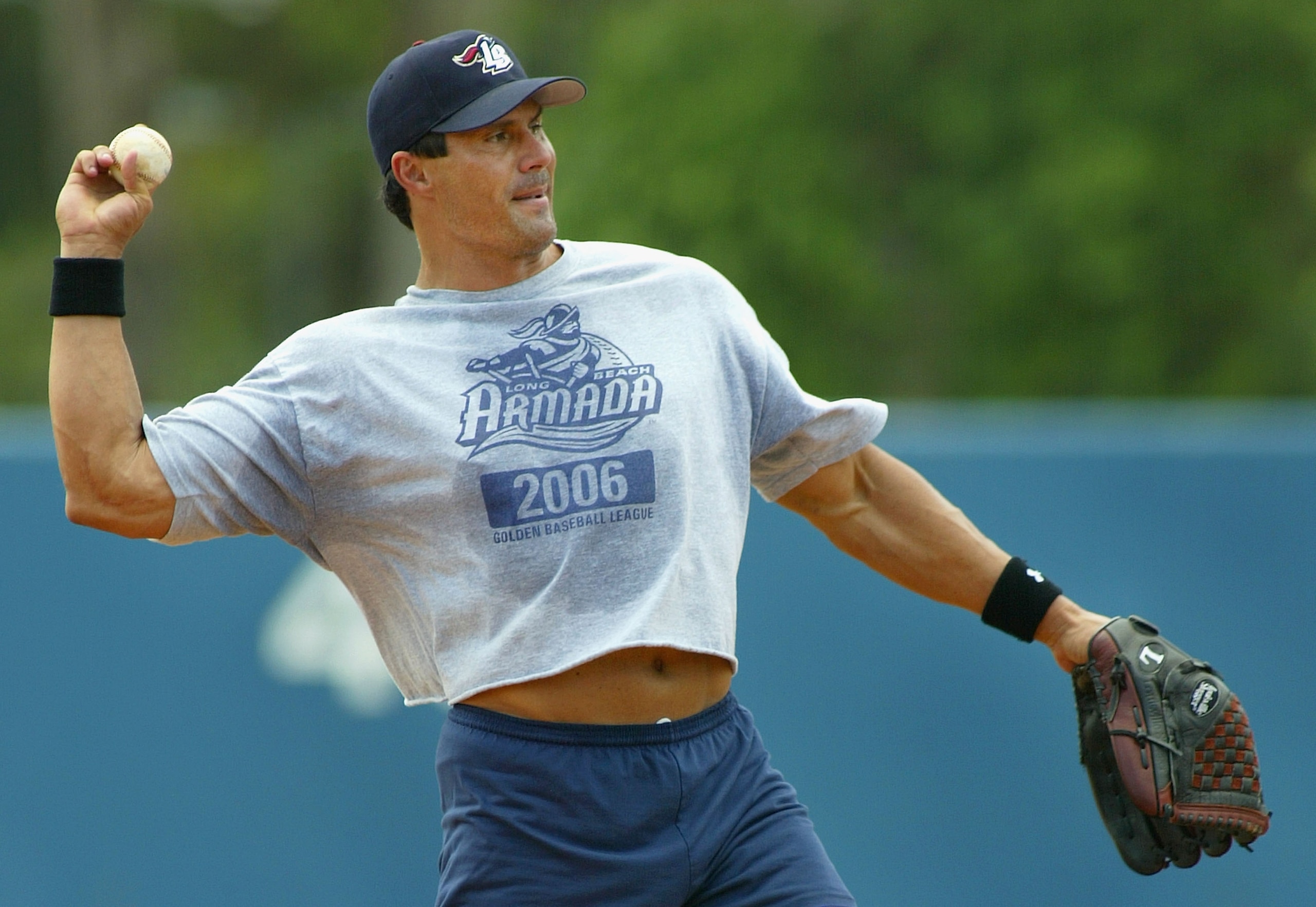 LONG BEACH, CA - JULY 16:  Jose Canseco #33 of the Long Beach Armada throws the ball in warm ups before the Golden Baseball League game against the Fullerton Flyers on July 16, 2006 at Blair Field in Long Beach, California.  (Photo By Christian Petersen/G