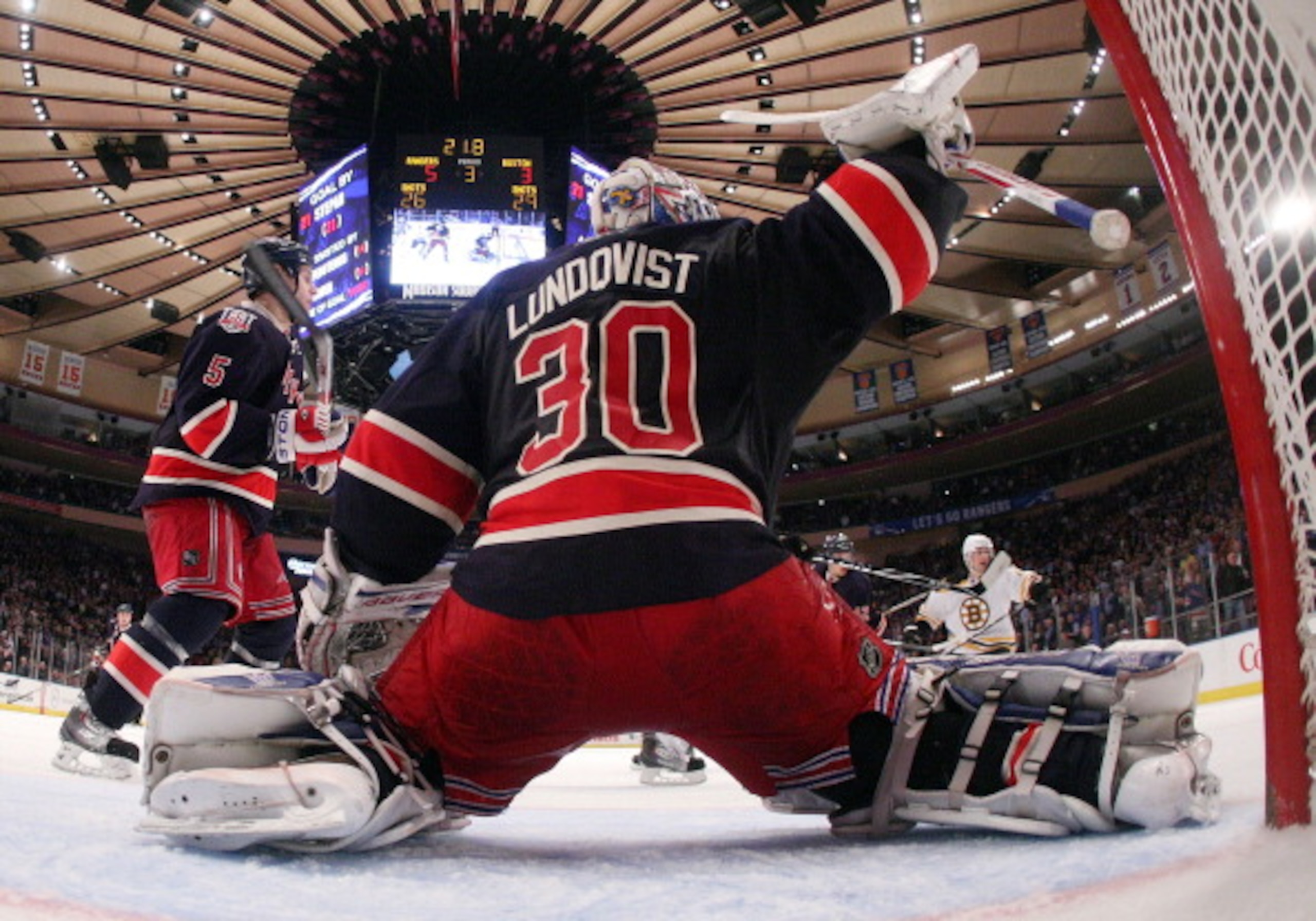 NEW YORK, NY - APRIL 04: Henrik Lundqvist #30 of the New York Rangers makes the third period save against the Boston Bruins at Madison Square Garden on April 4, 2011 in New York City. The Rangers defeated the Bruins 5-3.  (Photo by Bruce Bennett/Getty Ima