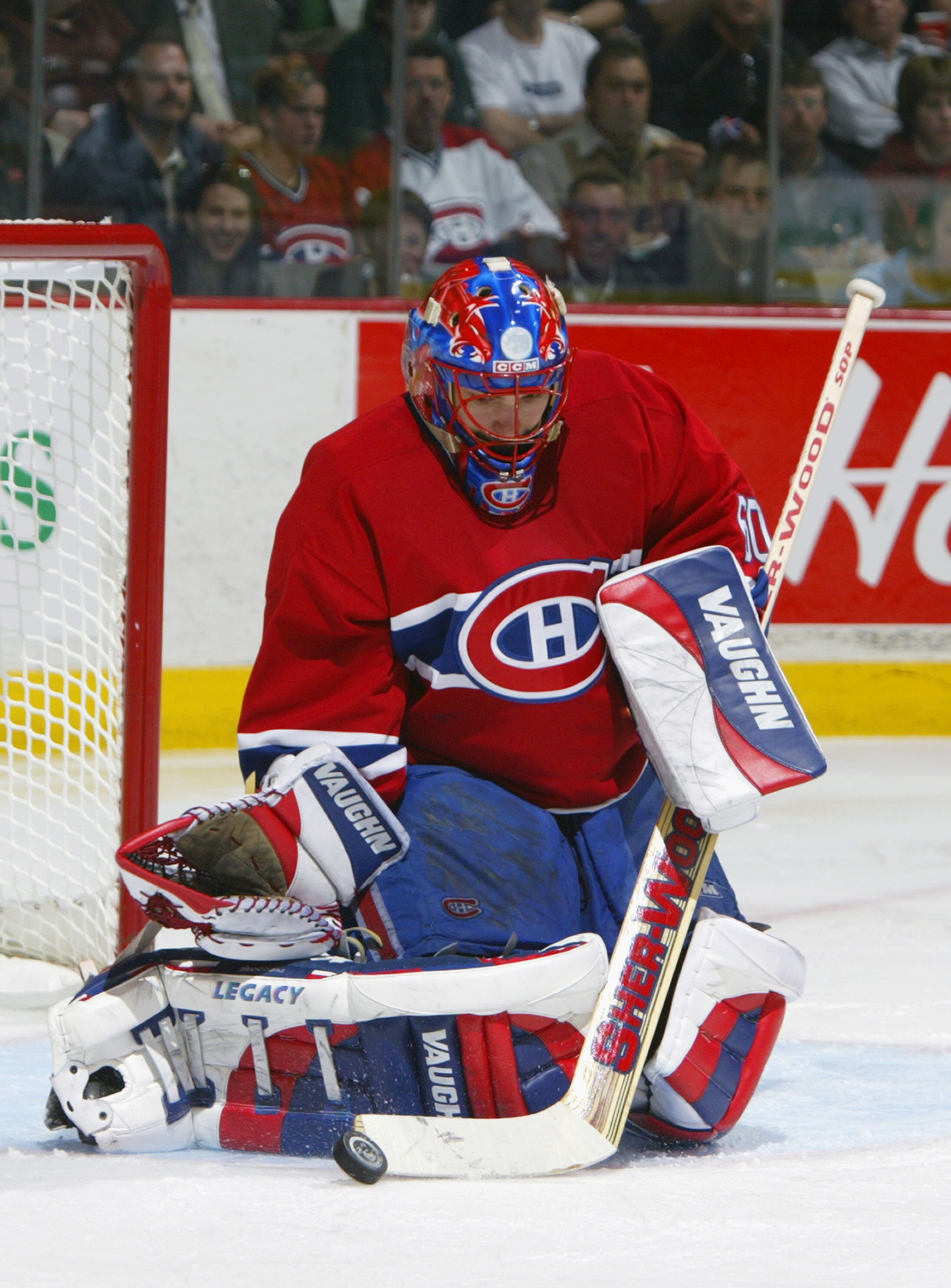 MONTREAL - APRIL 29:  Jose Theodore #60 of the Montreal Canadiens makes a stick save against the Tampa Bay Lightning during game four of the eastern conference semifinals on April 29, 2004 at the Bell Centre in Montreal, Quebec.  The Lightning defeated th