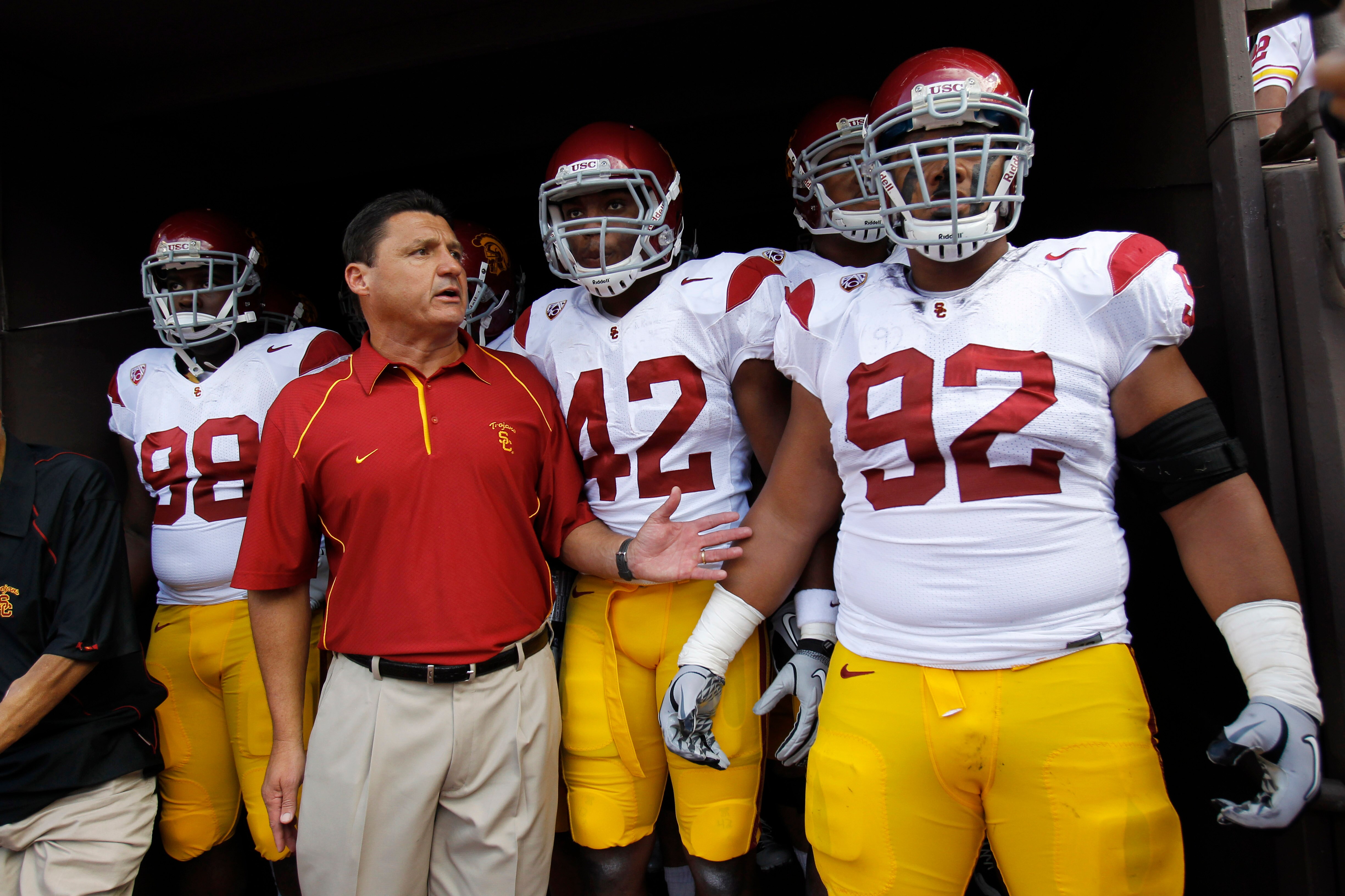 HONOLULU - SEPTEMBER 02:  Defensive and Recruiting Coordinator Ed Orgeron of the University of Souther California Trojans leads the team to the edge of the tunnel before the start of the Trojan's season opener against the Hawaii Warriors at Aloha Stadium