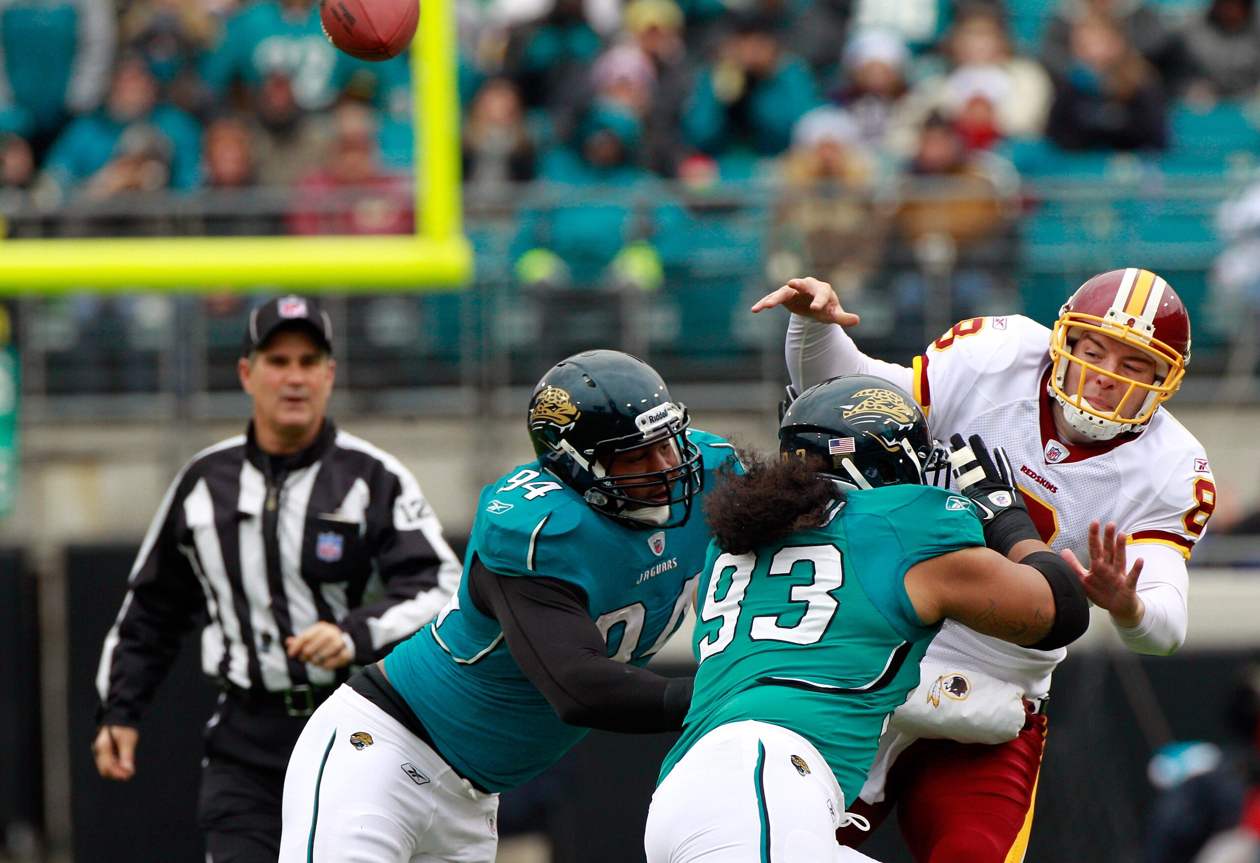JACKSONVILLE, FL - DECEMBER 26: Quarterback Rex Grossman #8 of the Washington Redskins is pressured by Tyson Alualu #93 and Jeremy Mincey #94 of the Jacksonville Jaguars during the game at EverBank Field on December 26, 2010 in Jacksonville, Florida. (P JACKSONVILLE, FL - DECEMBER 26: Quarterback Rex Grossman #8 of the Washington Redskins is pressured by Tyson Alualu #93 and Jeremy Mincey #94 of the Jacksonville Jaguars during the game at EverBank Field on December 26, 2010 in Jacksonville, Florida. (P