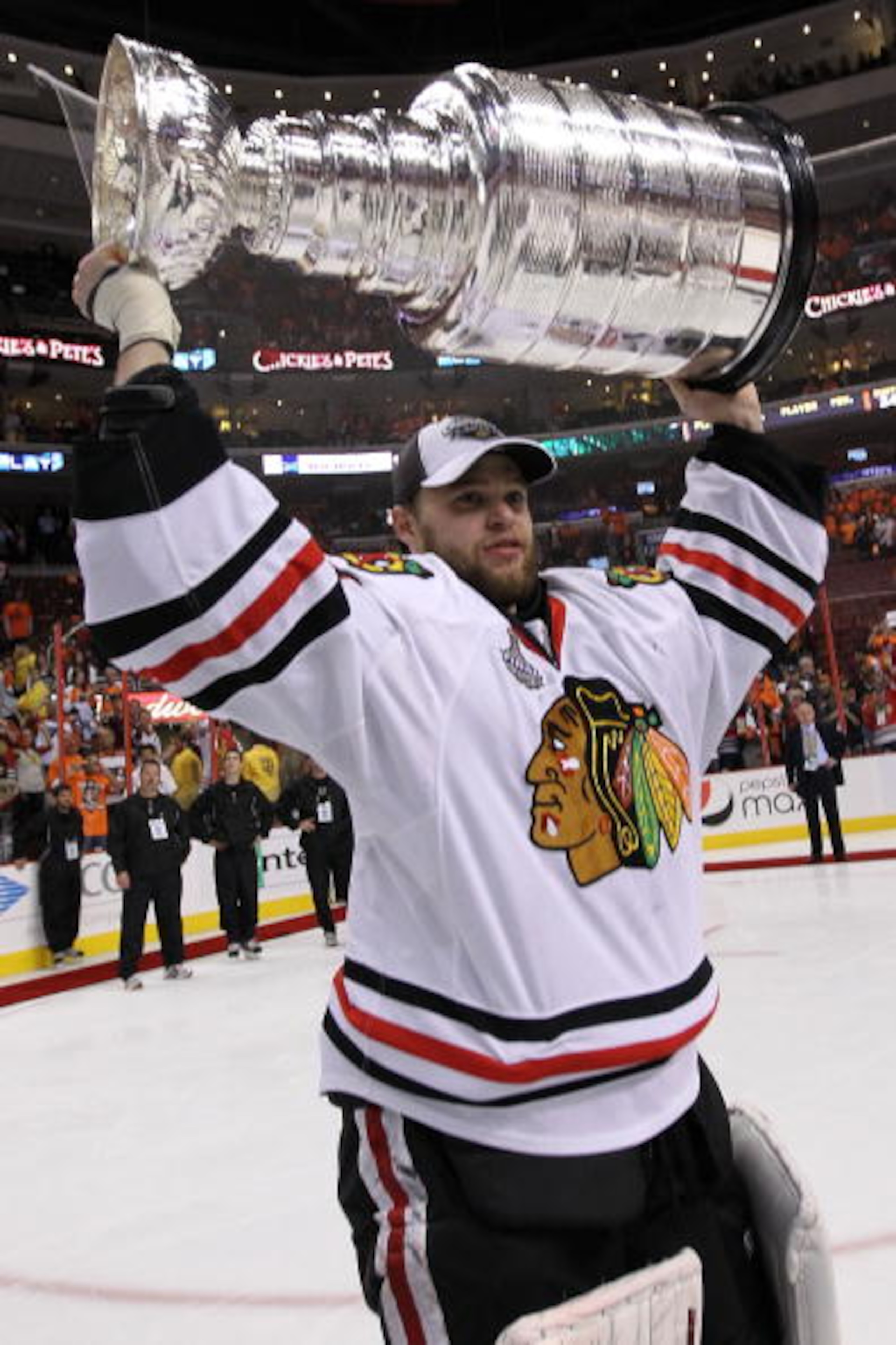 PHILADELPHIA - JUNE 09:  Antti Niemi #31 of the Chicago Blackhawks hoists the Stanley Cup after teammate Patrick Kane #88 scored the game-winning goal in overtime to defeat the Philadelphia Flyers 4-3 and win the Stanley Cup in Game Six of the 2010 NHL St