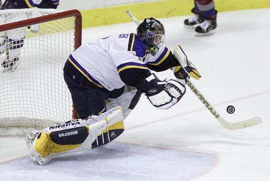 16 May 2001:  Roman Turek #1 of the St. Louis Blues falls on the puck to make a save against the Colorado Avalanche in the second period during Game 3 of the Western Conference finals at the Savvis Center in St. Louis, Missouri.  DIGITAL IMAGE Mandatory C