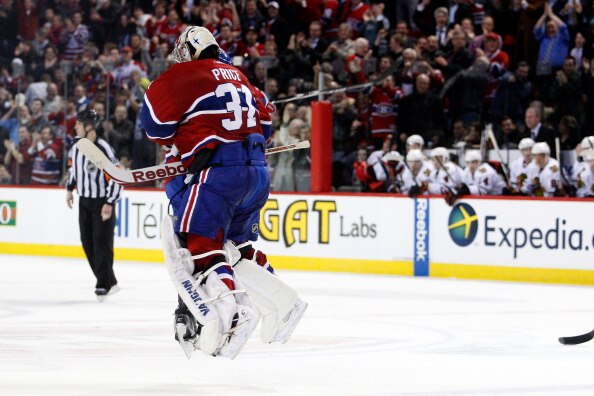 MONTREAL, CANADA - APRIL 5:  P.K. Subban #76 of the Montreal Canadiens and Carey Price #31 jump into each other after defeating the Chicago Blackhawks and clinching a playoff position during the NHL game at the Bell Centre on April 5, 2011 in Montreal, Qu
