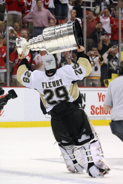 DETROIT - JUNE 12: Marc-Andre Fleury #29 of the Pittsburgh Penguins celebrates with the Stanley Cup after defeating the Detroit Red Wings by a score of 2-1 to win Game Seven and the 2009 NHL Stanley Cup Finals at Joe Louis Arena on June 12, 2009 in Detroi