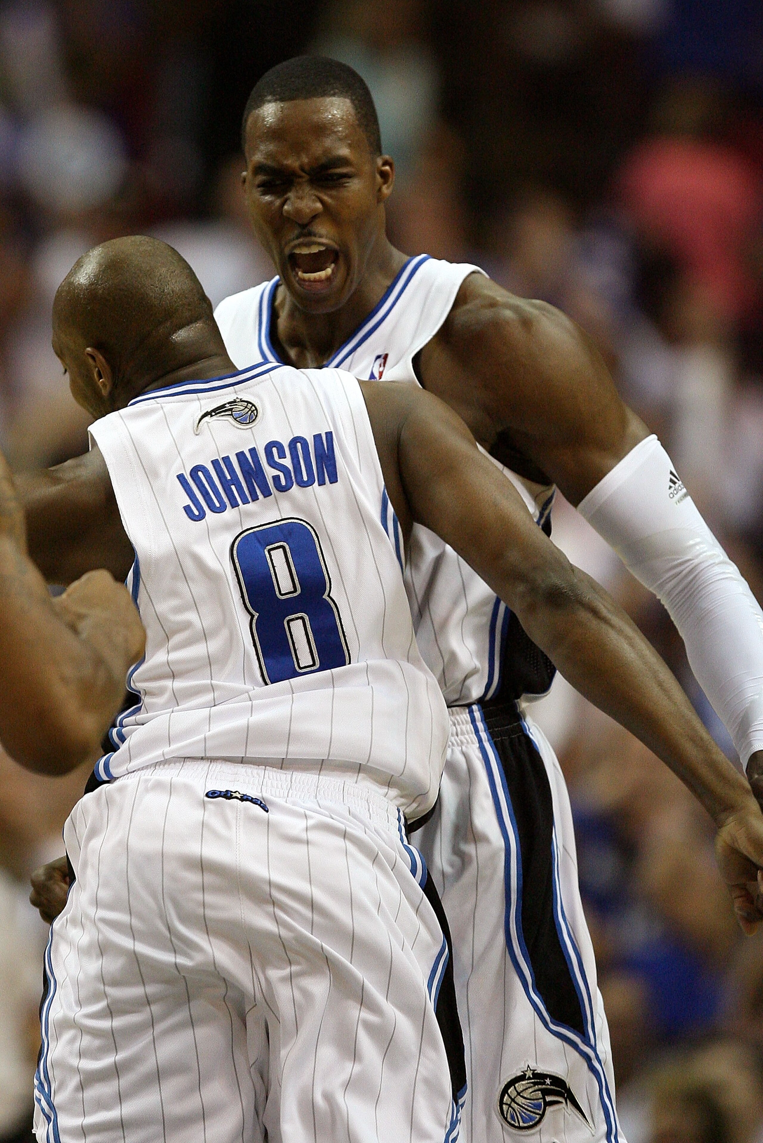 ORLANDO, FL - MAY 30: Dwight Howard #12 and Anthony Johnson #8 of the Orlando Magic celebrate after a play against the Cleveland Cavaliers in Game Six of the Eastern Conference Finals during the 2009 Playoffs at Amway Arena on May 30, 2009 in Orlando, Flo