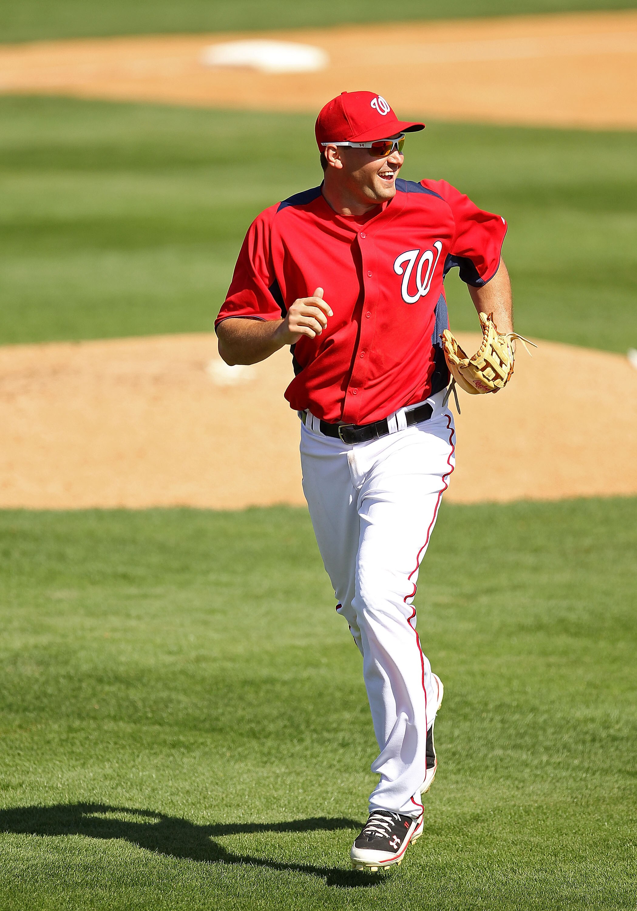 VIERA, FL - MARCH 02:  Ryan Zimmerman #11 of the Washington Nationals jogs back to the dugout during a Spring Training game against the Florida Marlinsat Space Coast Stadium on March 2, 2011 in Viera, Florida.  (Photo by Mike Ehrmann/Getty Images)