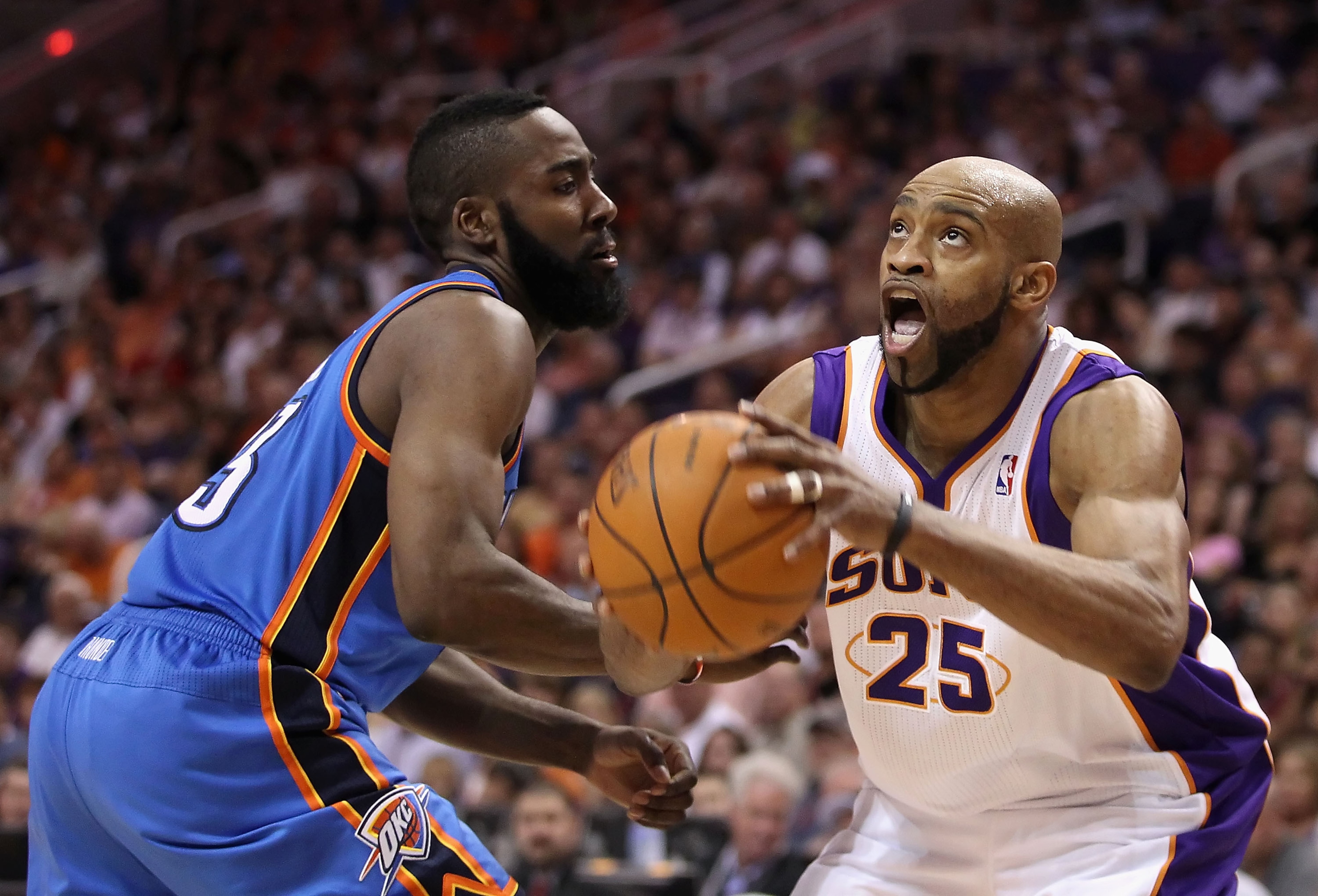 PHOENIX, AZ - MARCH 30:  Vince Carter #25 of the Phoenix Suns drives to the basket against James Harden #13 of the Oklahoma City Thunder during the NBA game at US Airways Center on March 30, 2011 in Phoenix, Arizona.  The Thunder defeated the Suns 116-98.