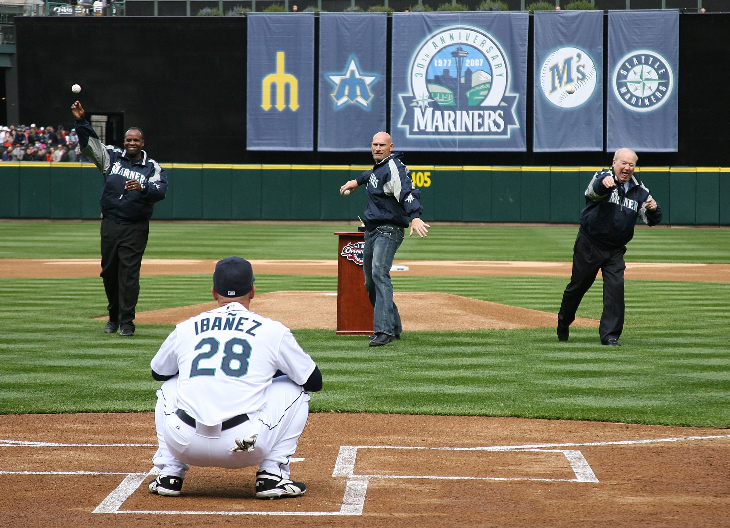SEATTLE - APRIL 2:  (L-R) Former Mariners Alvin Davis, Jay Buhner, and team announcer Dave Niehaus of the Seattle Mariners throw out the ceremonial first pitch of the game on opening day against the Oakland A's at Safeco Field April 2, 2007 in Seattle, Wa