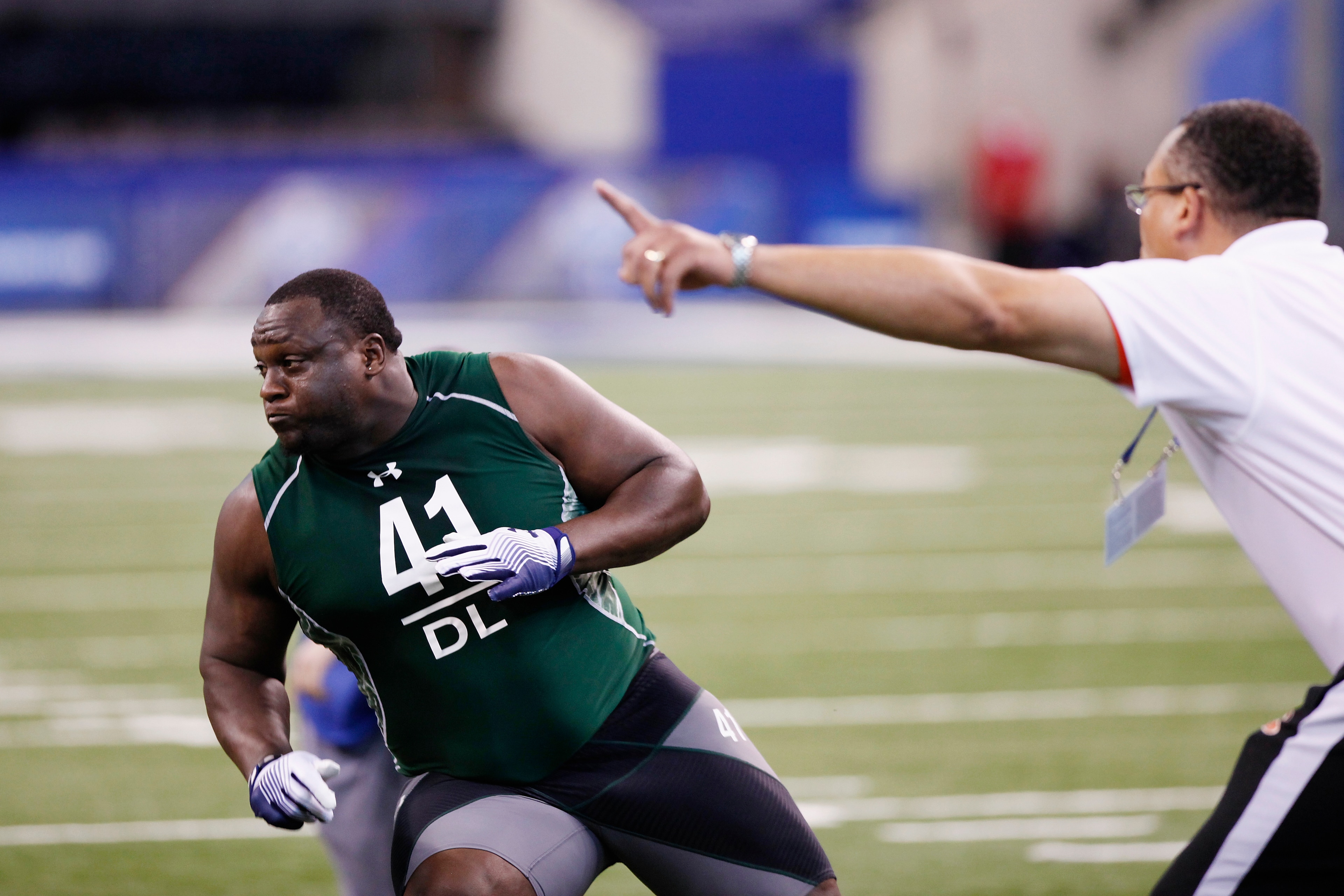 INDIANAPOLIS, IN - FEBRUARY 28: Defensive lineman Jerrell Powe of Mississippi runs through a drill during the 2011 NFL Scouting Combine at Lucas Oil Stadium on February 28, 2011 in Indianapolis, Indiana. (Photo by Joe Robbins/Getty Images)