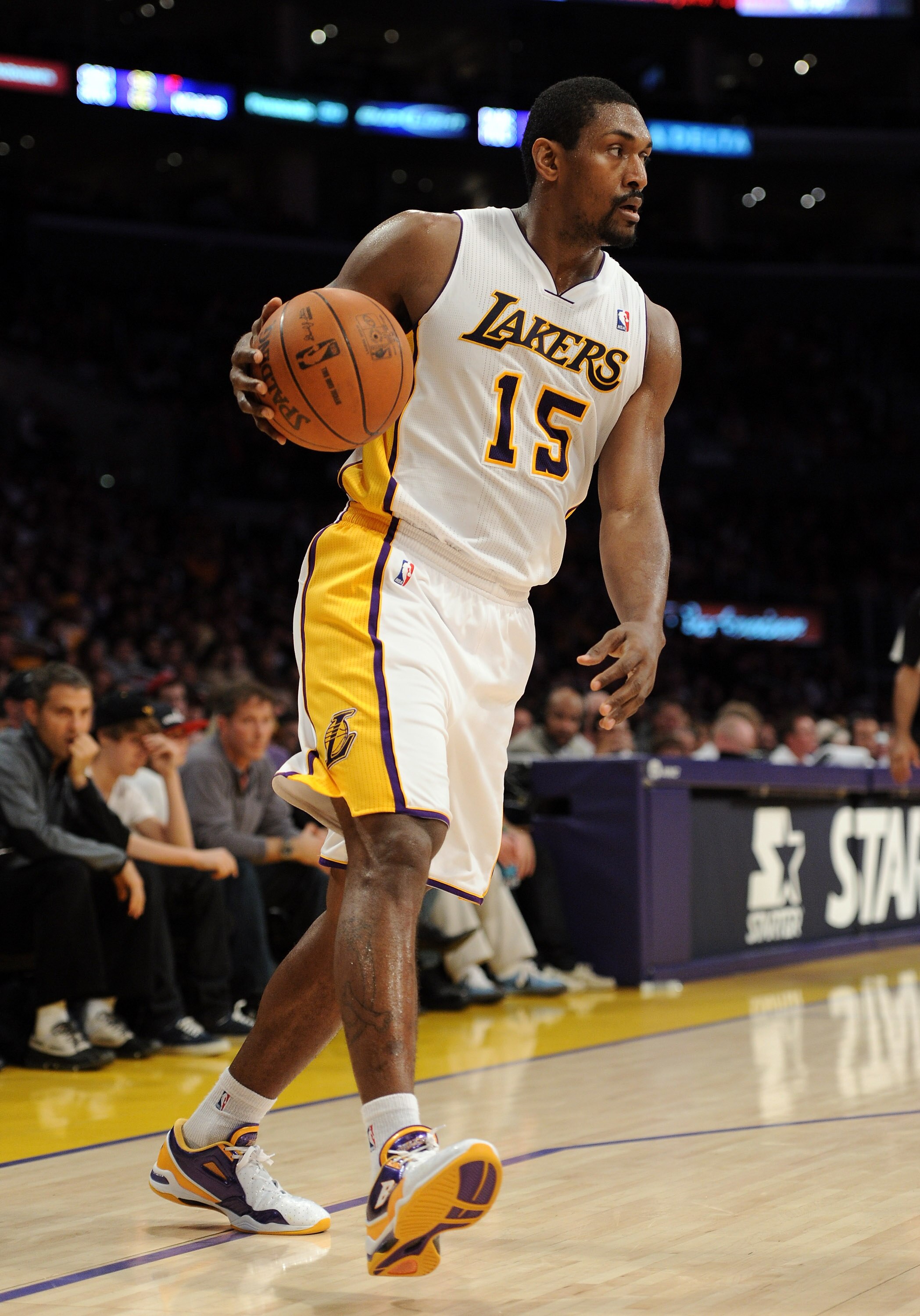 LOS ANGELES, CA - MARCH 20:  Ron Artest #15 of the Los Angeles Lakers dribbles against the Portland Trail Blazers at the Staples Center on March 20, 2011 in Los Angeles, California.  NOTE TO USER: User expressly acknowledges and agrees that, by downloadin
