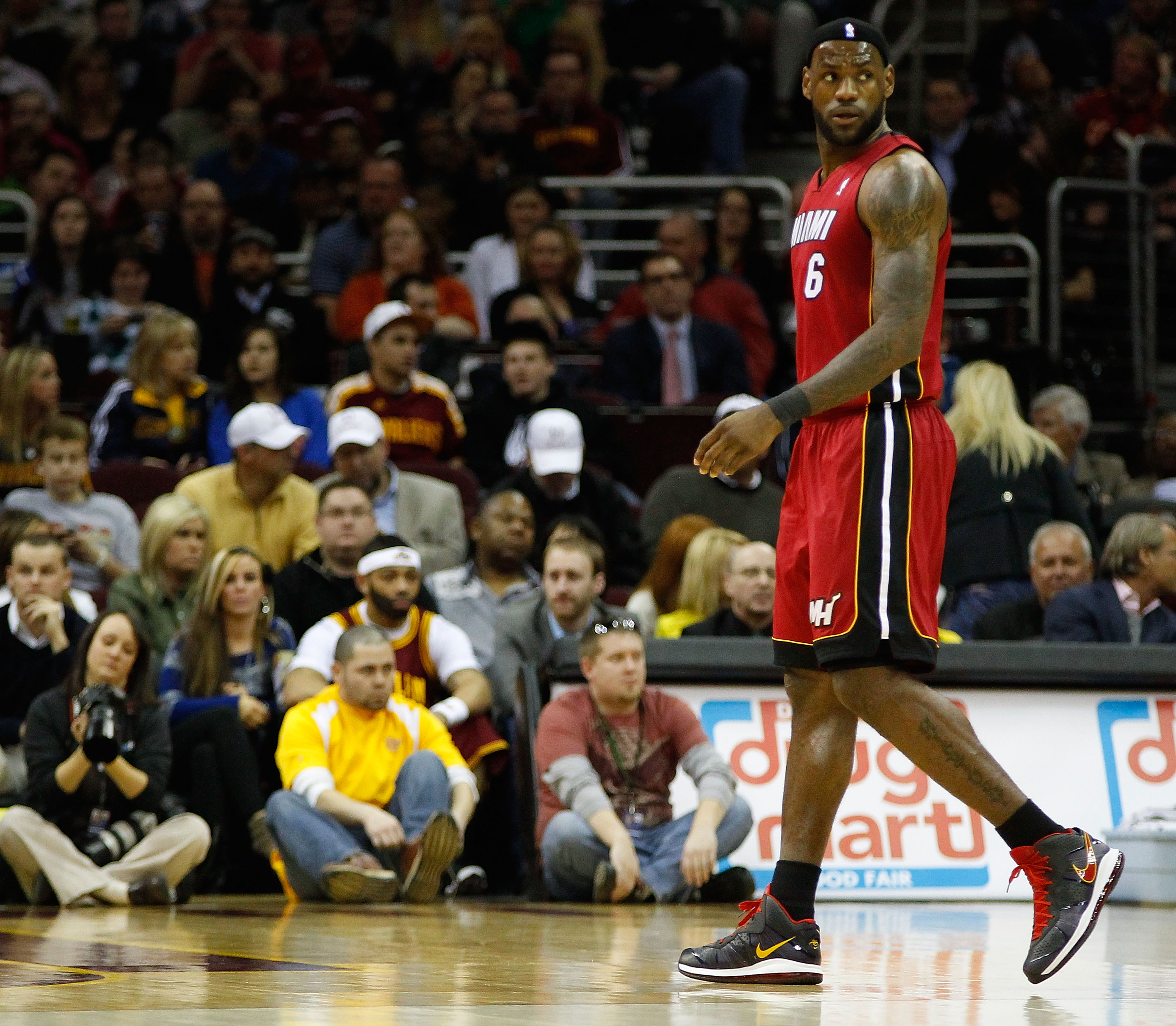 CLEVELAND - MARCH 29: LeBron James #6 of the Miami Heat walks back to the bench during the game against the Cleveland Cavaliers on March 29, 2011 at Quicken Loans Arena in Cleveland, Ohio. NOTE TO USER: User expressly acknowledges and agrees that, by down