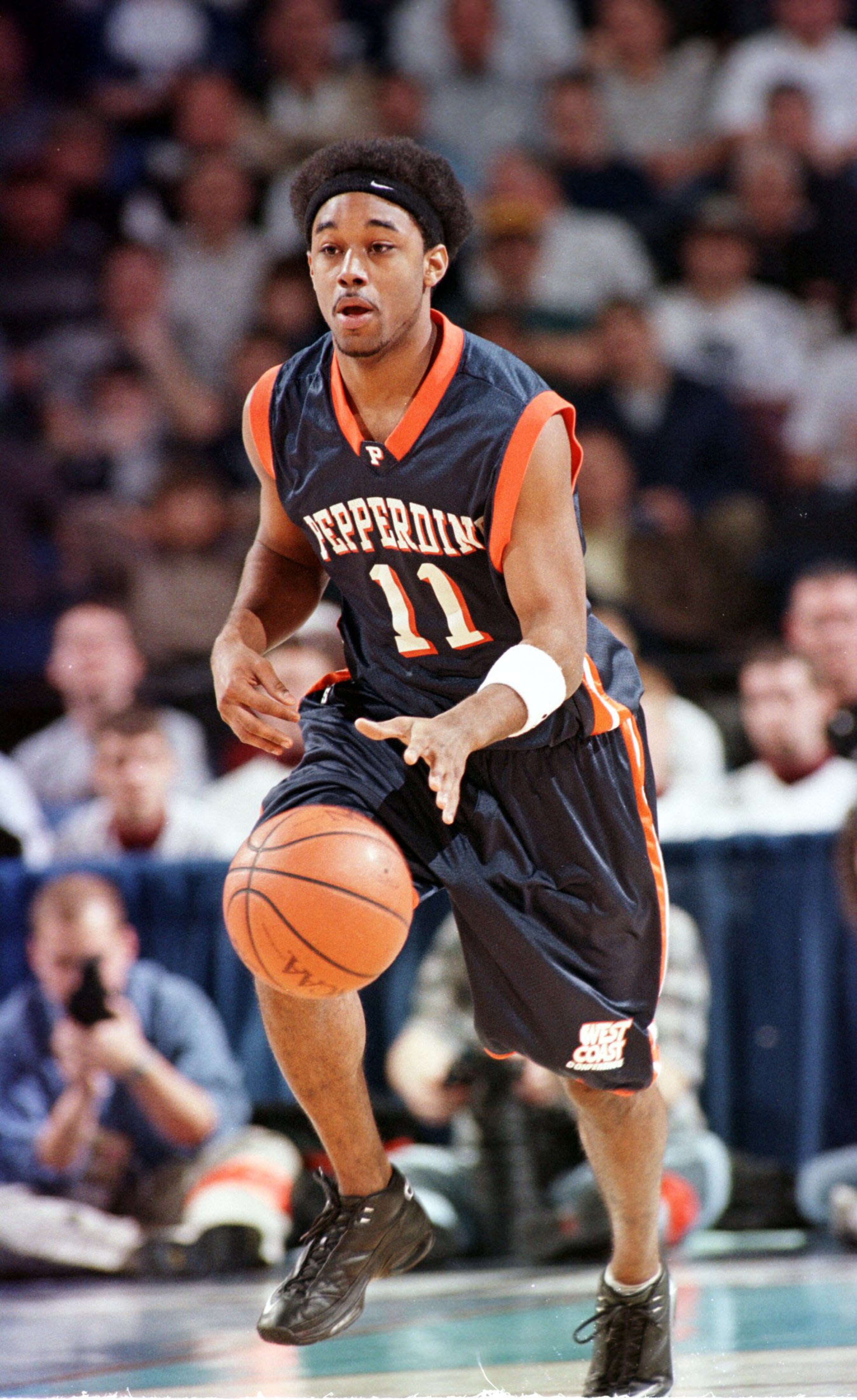 19 Mar 2000: Craig Lewis #11 of the Pepperdine Waves brings the ball up court during the NCAA East Regional second round game against the Oklahoma State Cowboys at the HSBC Arena in Buffalo, New York. Oklahoma State defeated Pepperdine 75-67 to advance to